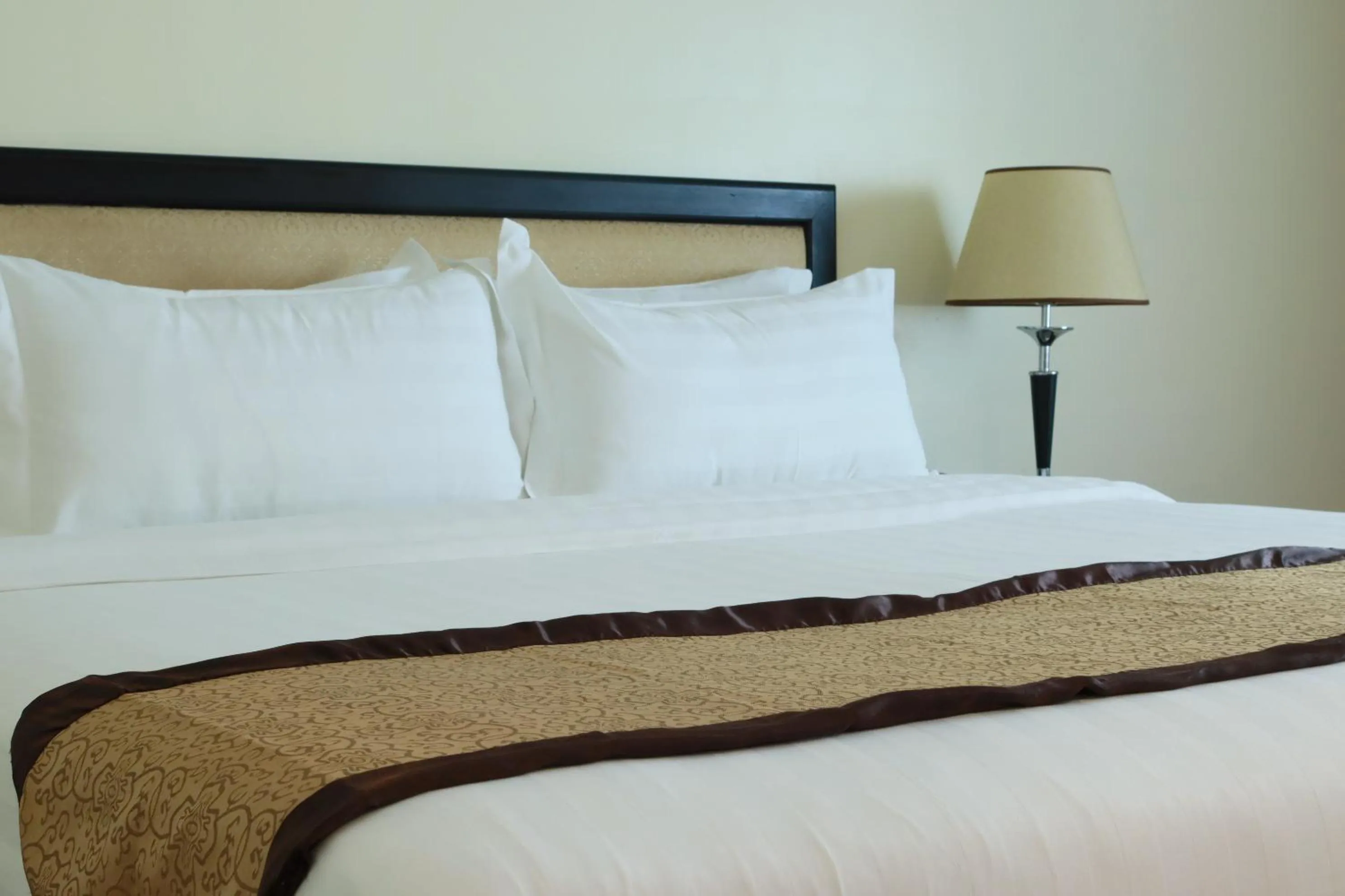 Bed in Mahasakor Inn