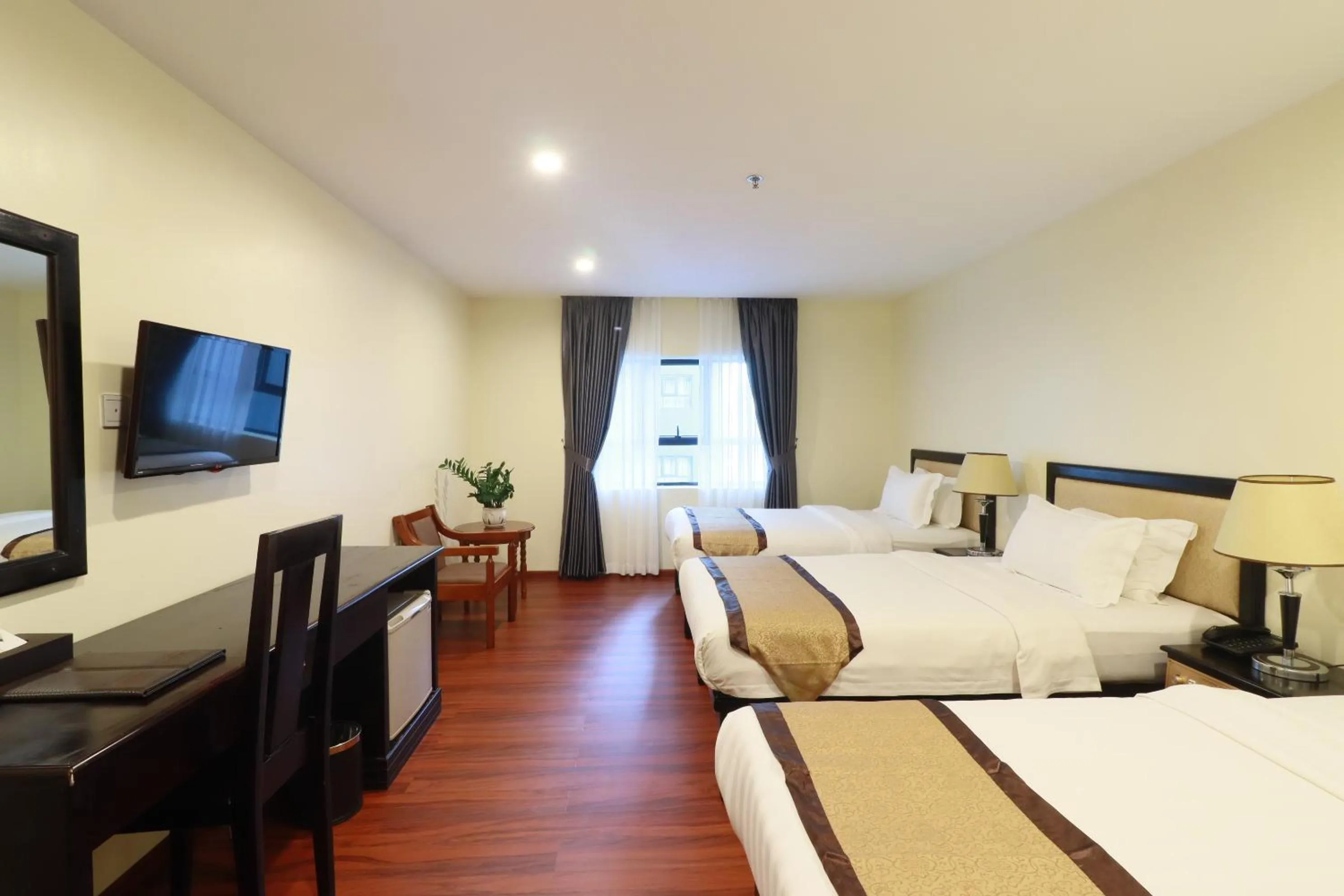 Bed in Mahasakor Inn