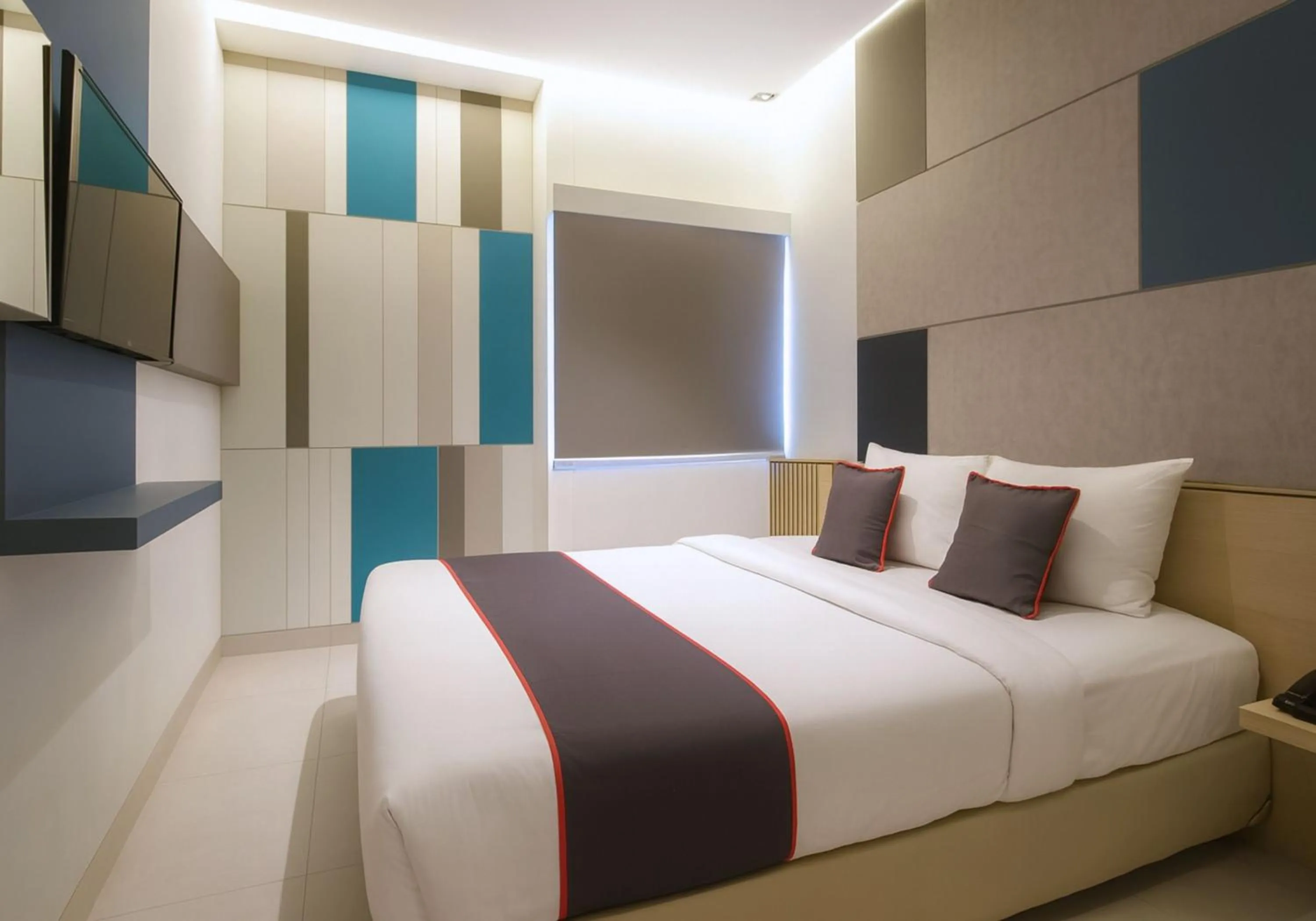 Bed in IXO Hotel Semarang