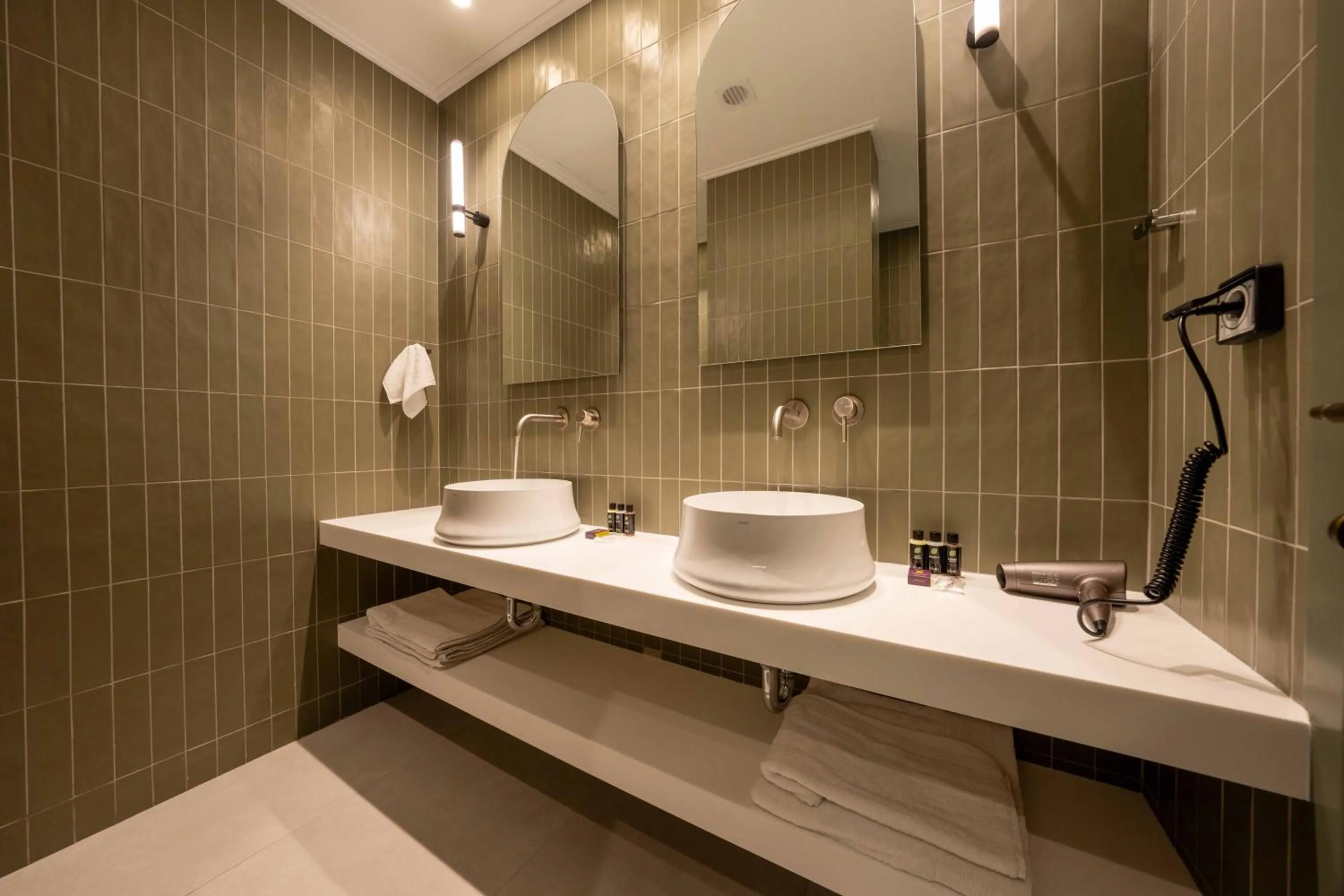 Bathroom in Whisper Athens Suites