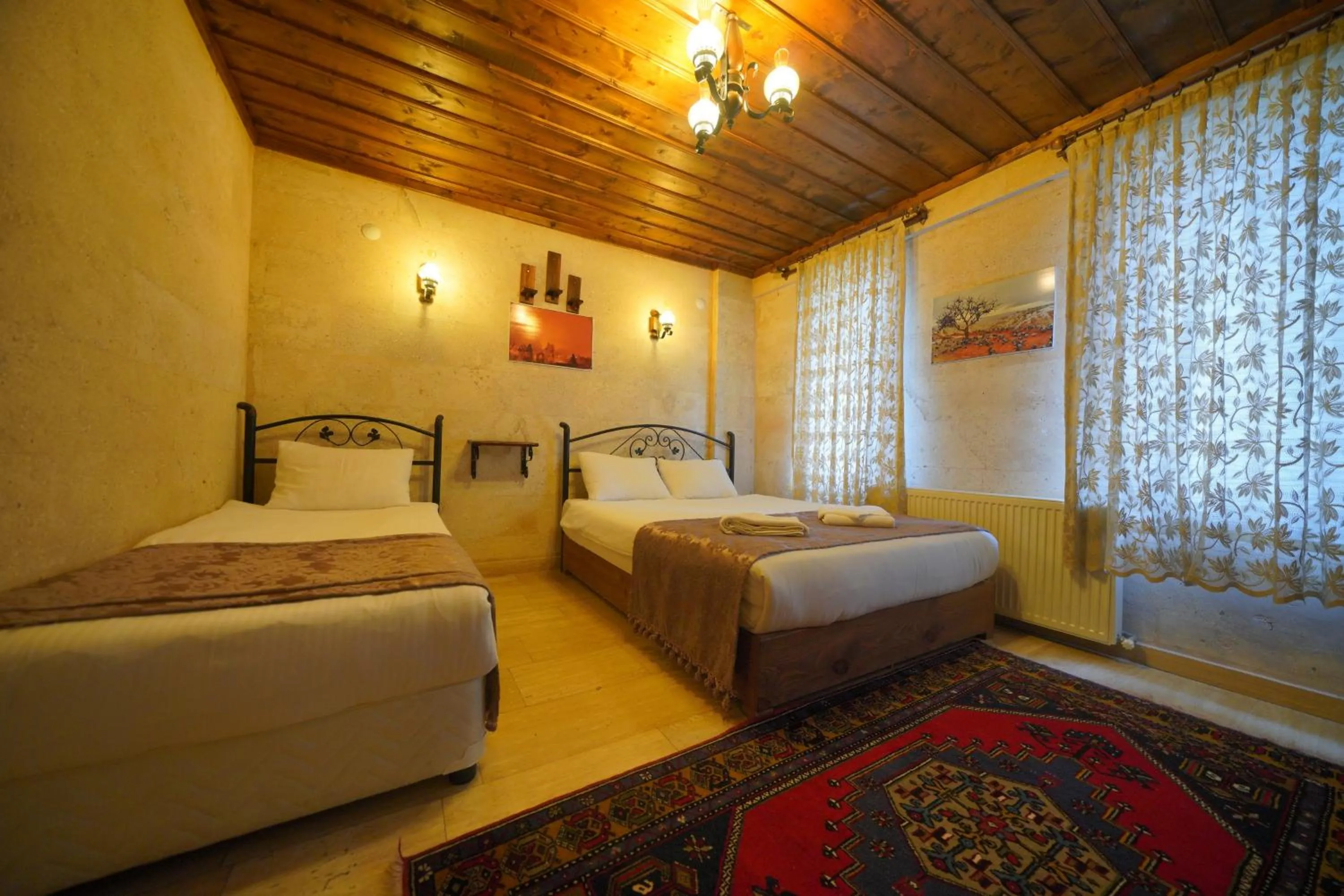 Bed in Goreme Cave Rooms&Pool