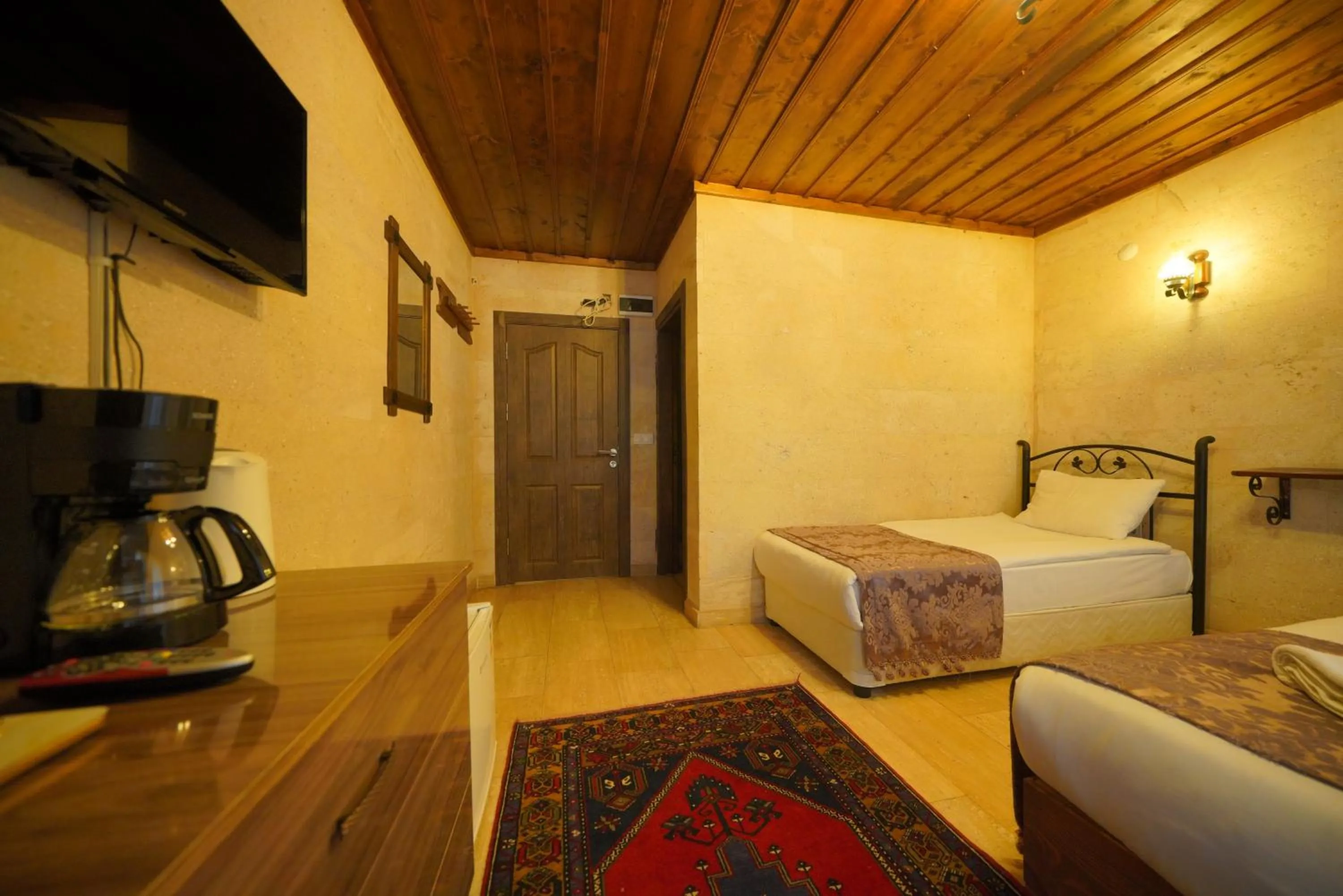 Bed in Goreme Cave Rooms&Pool