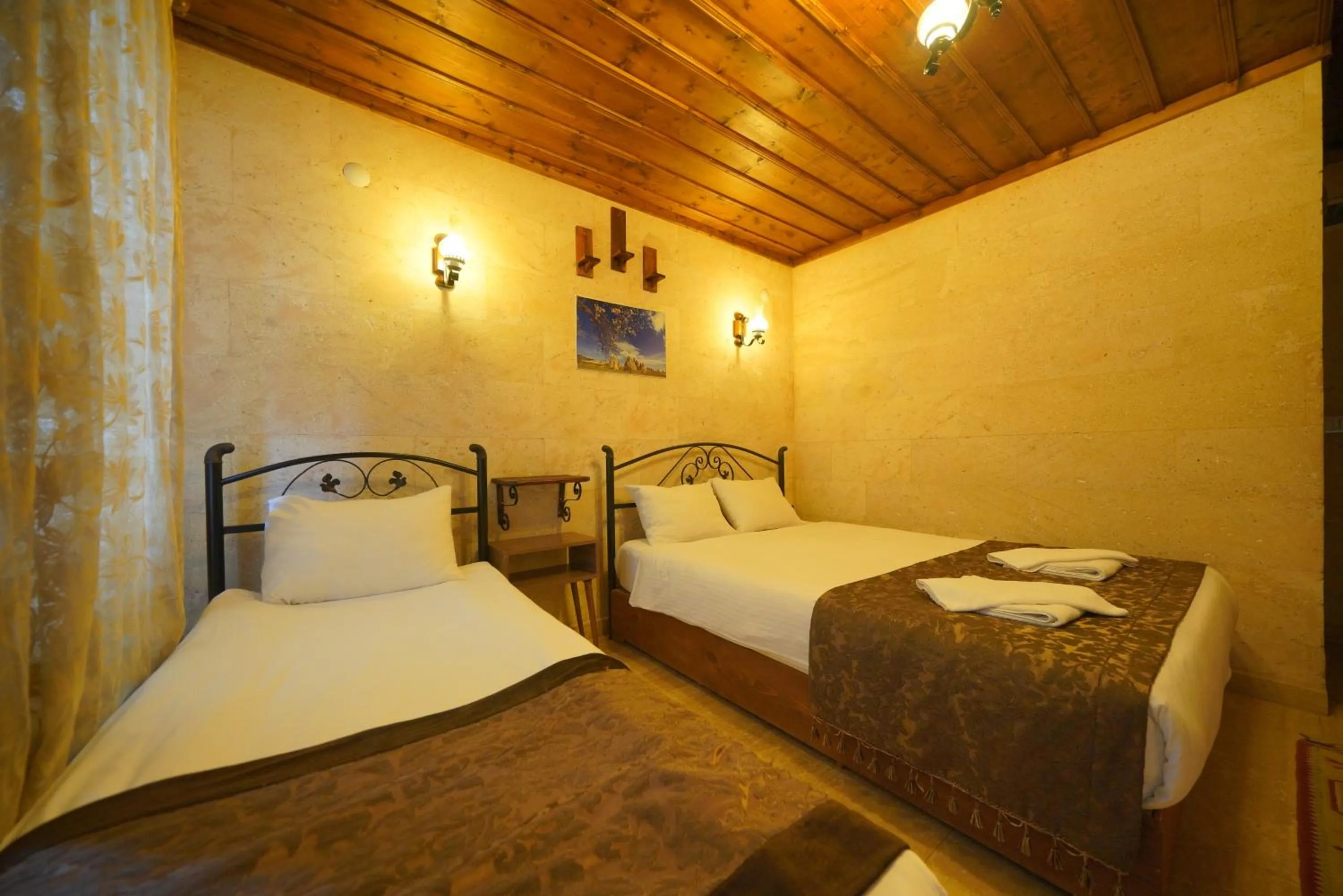 Bed in Goreme Cave Rooms&Pool