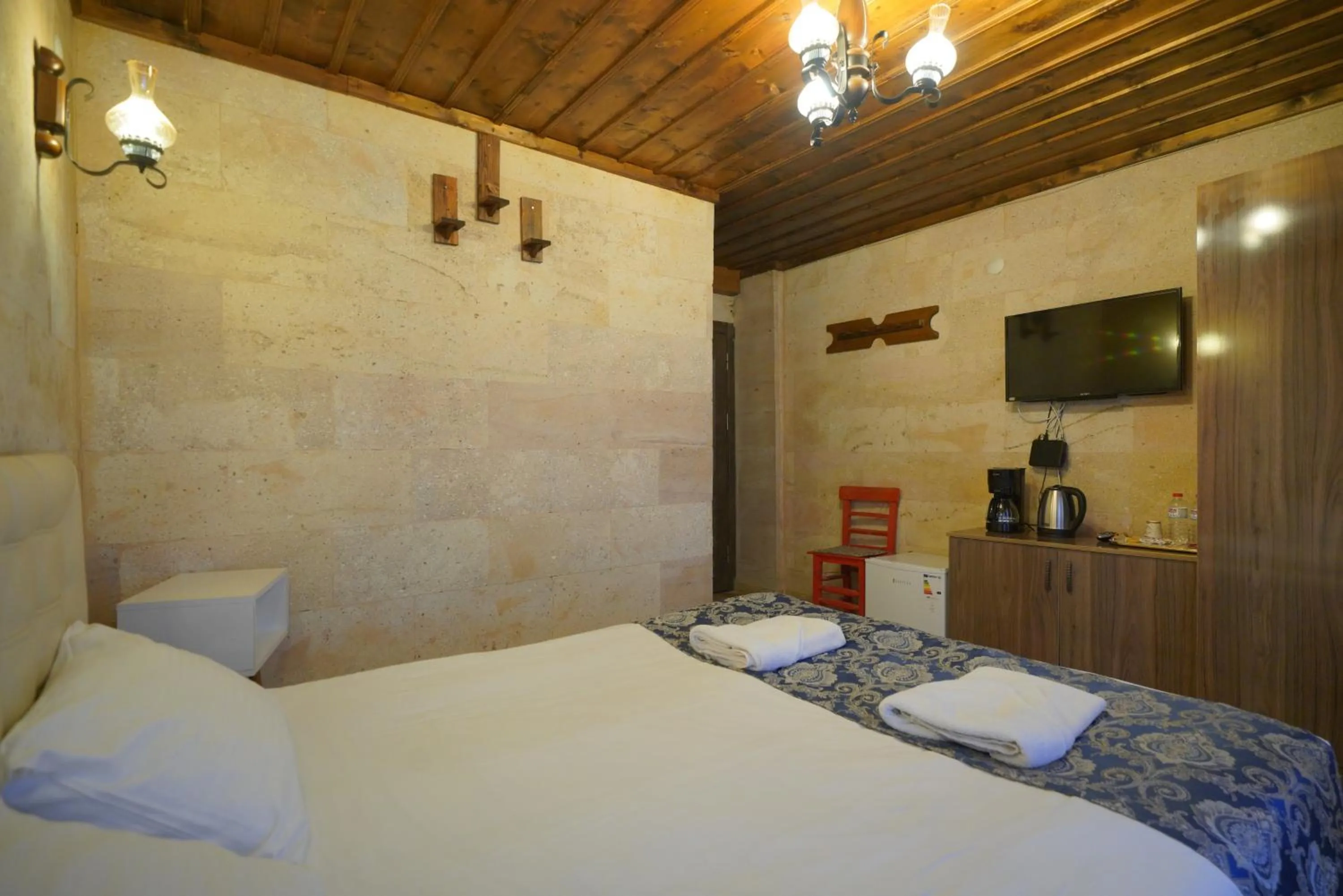 Bed in Goreme Cave Rooms&Pool