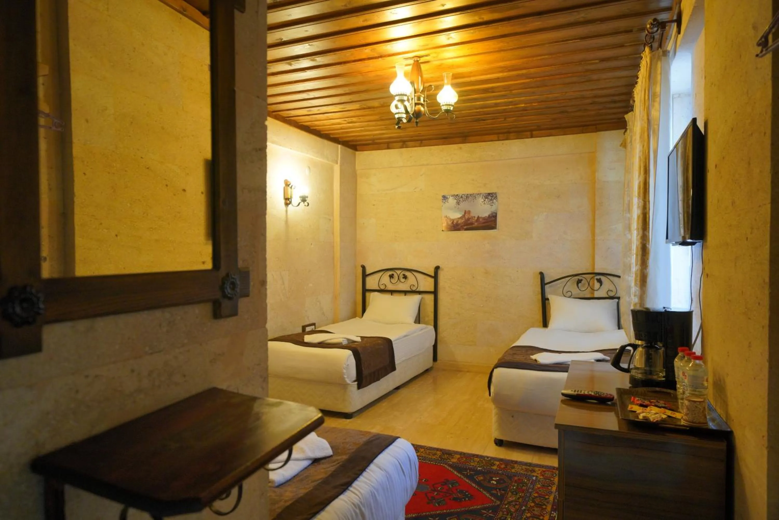 Bed in Goreme Cave Rooms&Pool