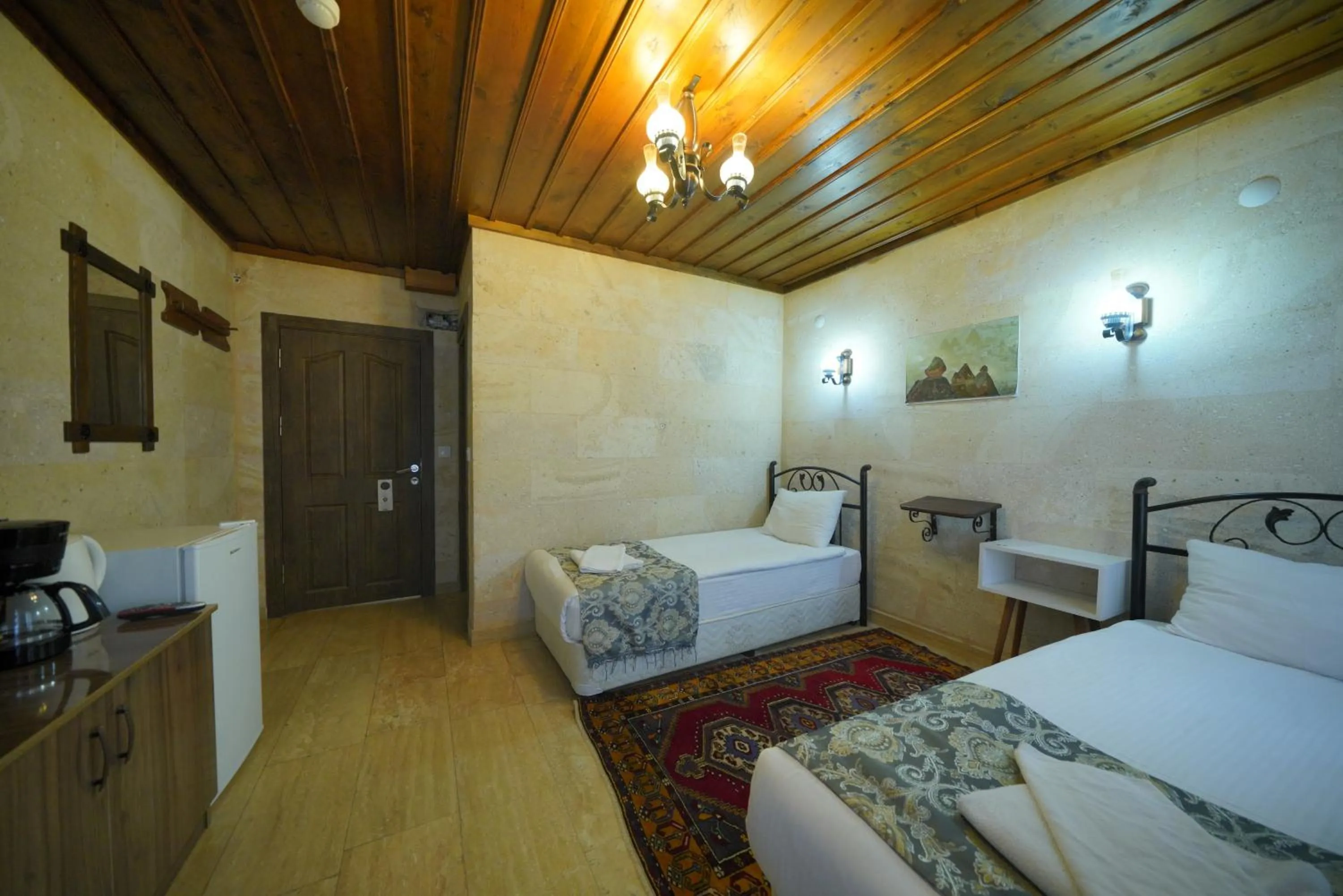 Bed in Goreme Cave Rooms&Pool