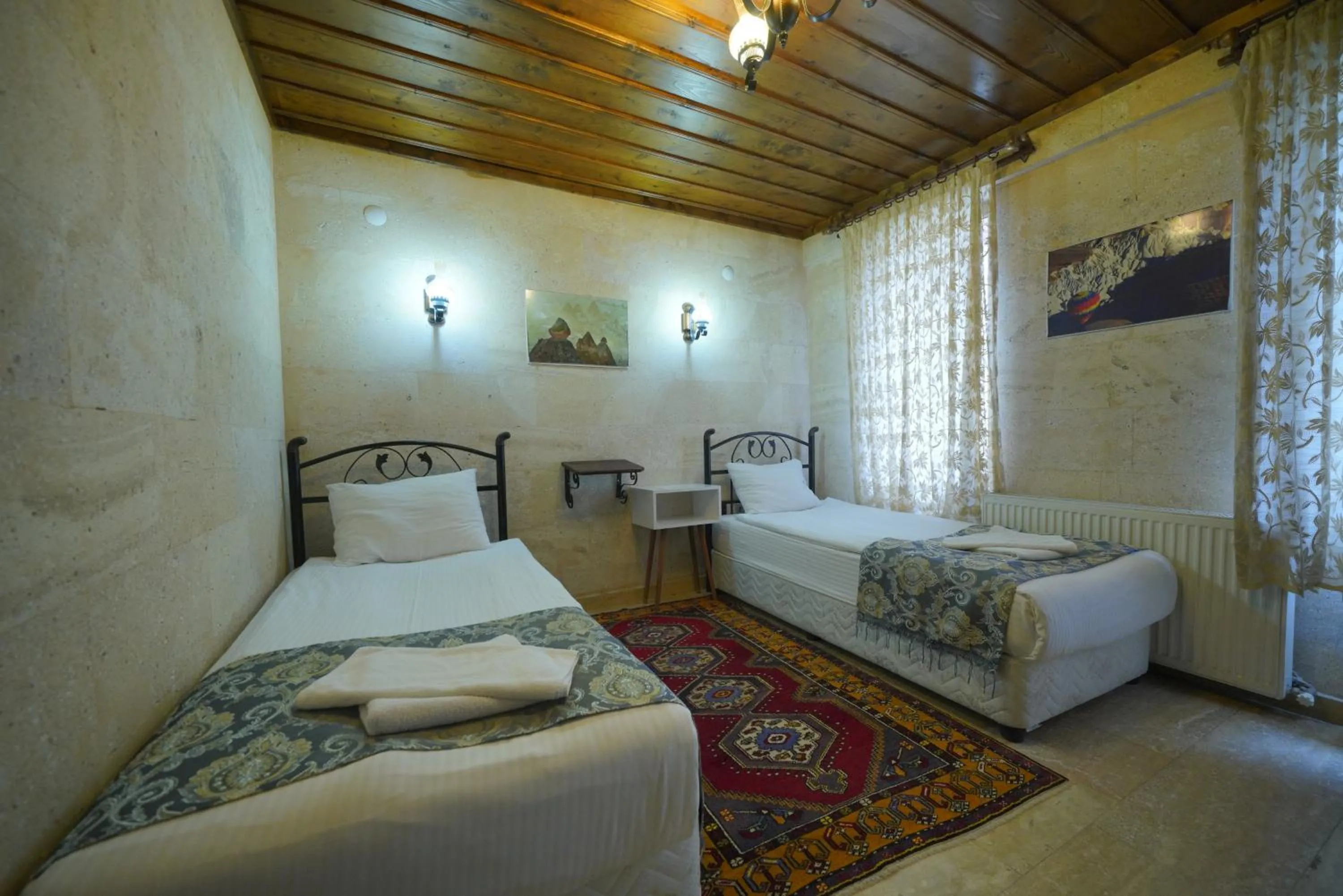 Bed in Goreme Cave Rooms&Pool
