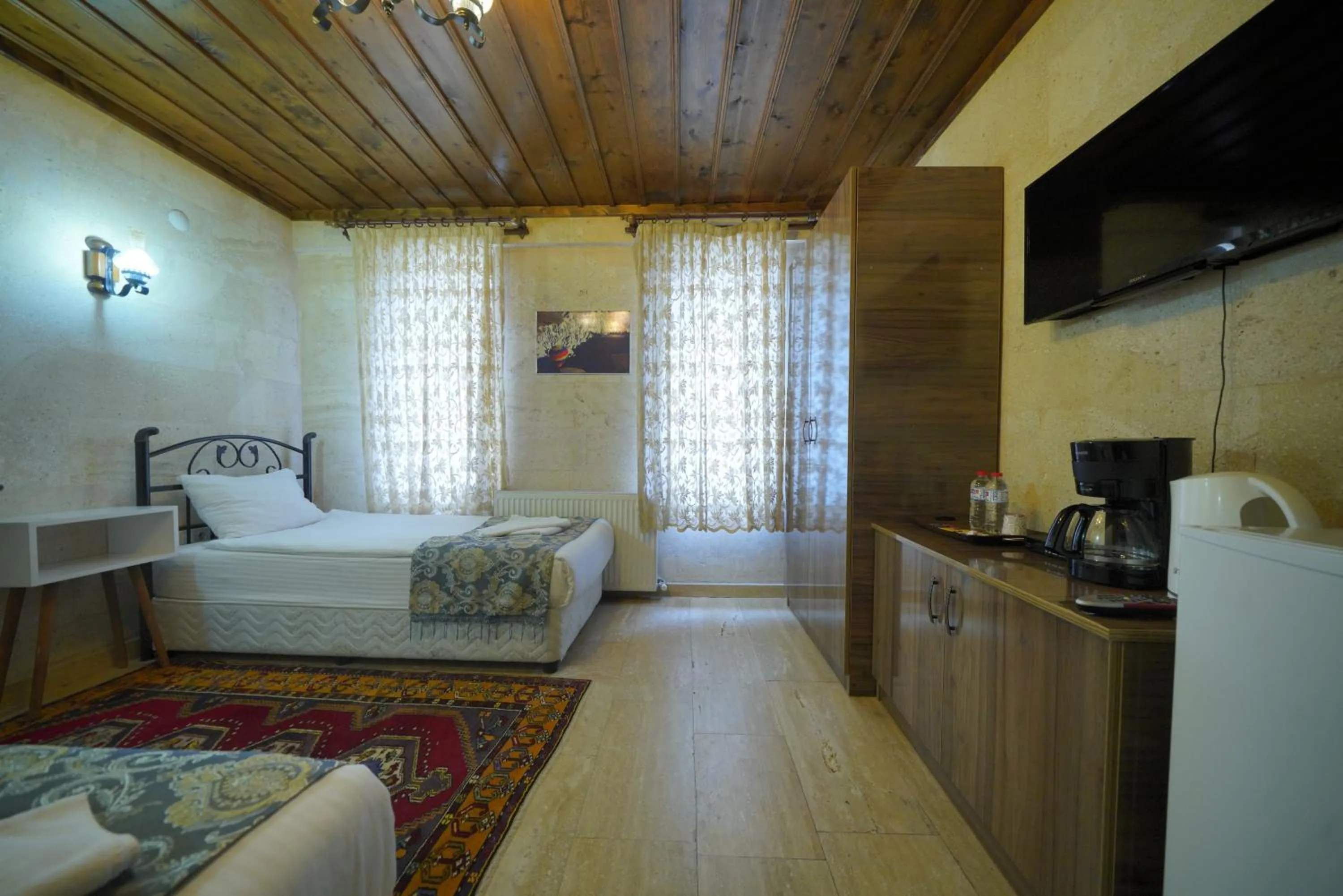 Bed in Goreme Cave Rooms&Pool