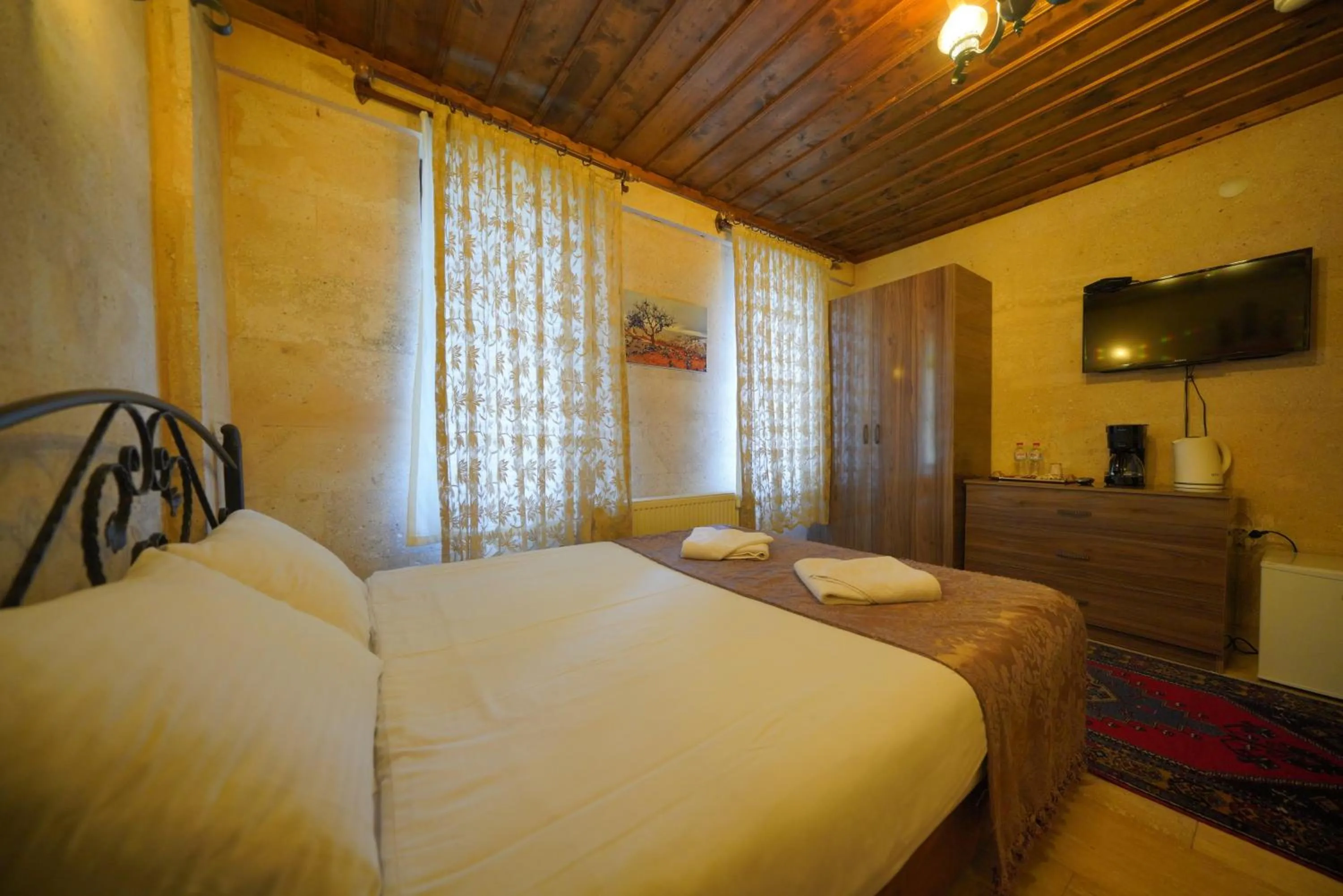 Bed in Goreme Cave Rooms&Pool