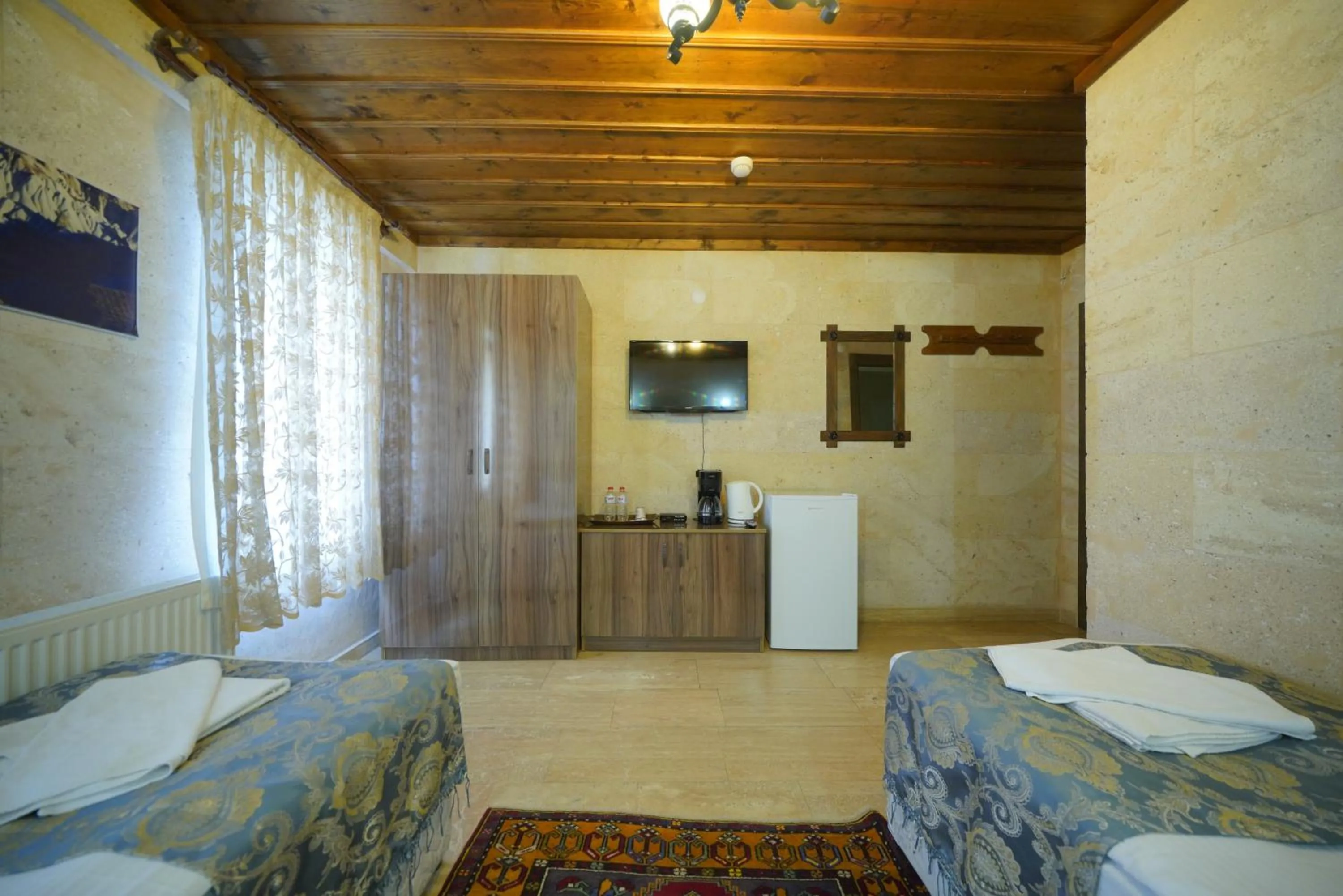 Bed in Goreme Cave Rooms&Pool