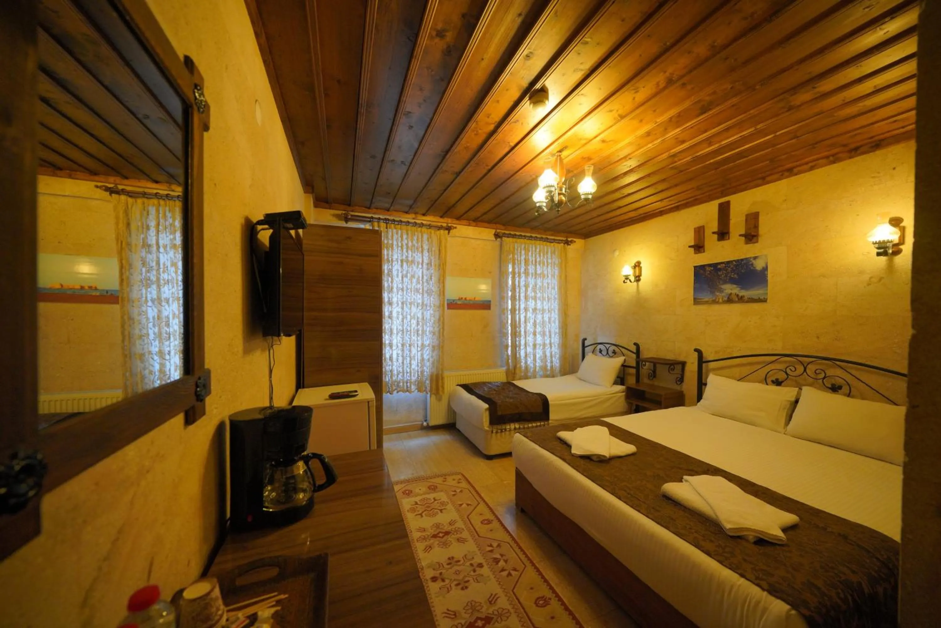 Bed in Goreme Cave Rooms&Pool