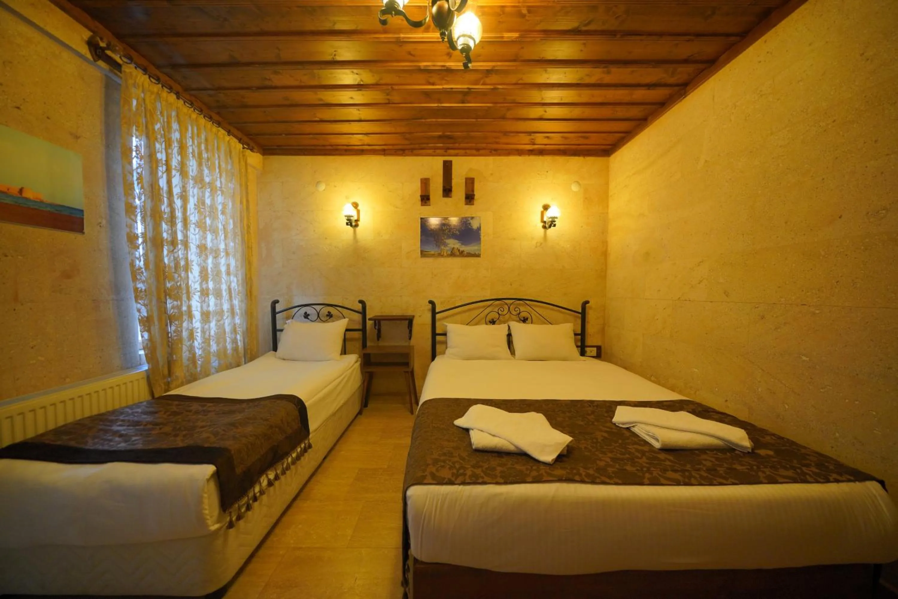 Bed in Goreme Cave Rooms&Pool