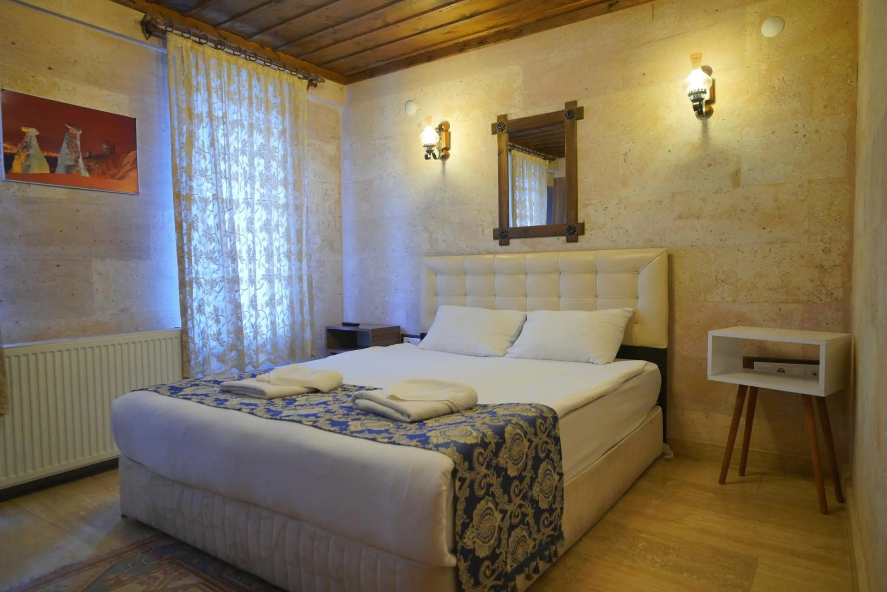 Bed in Goreme Cave Rooms&Pool