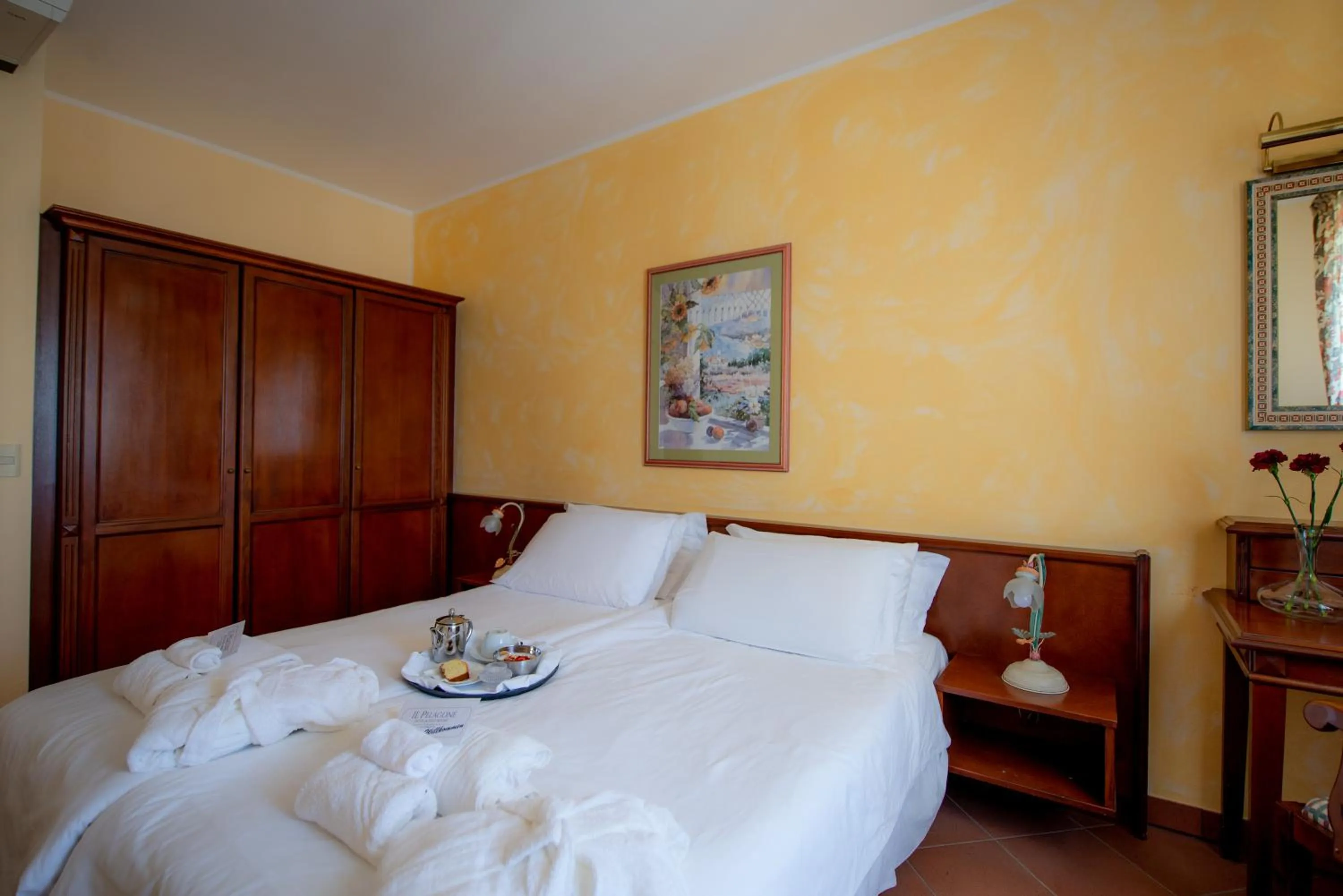 Bedroom, Bed in Il Pelagone Hotel & Golf Resort Toscana