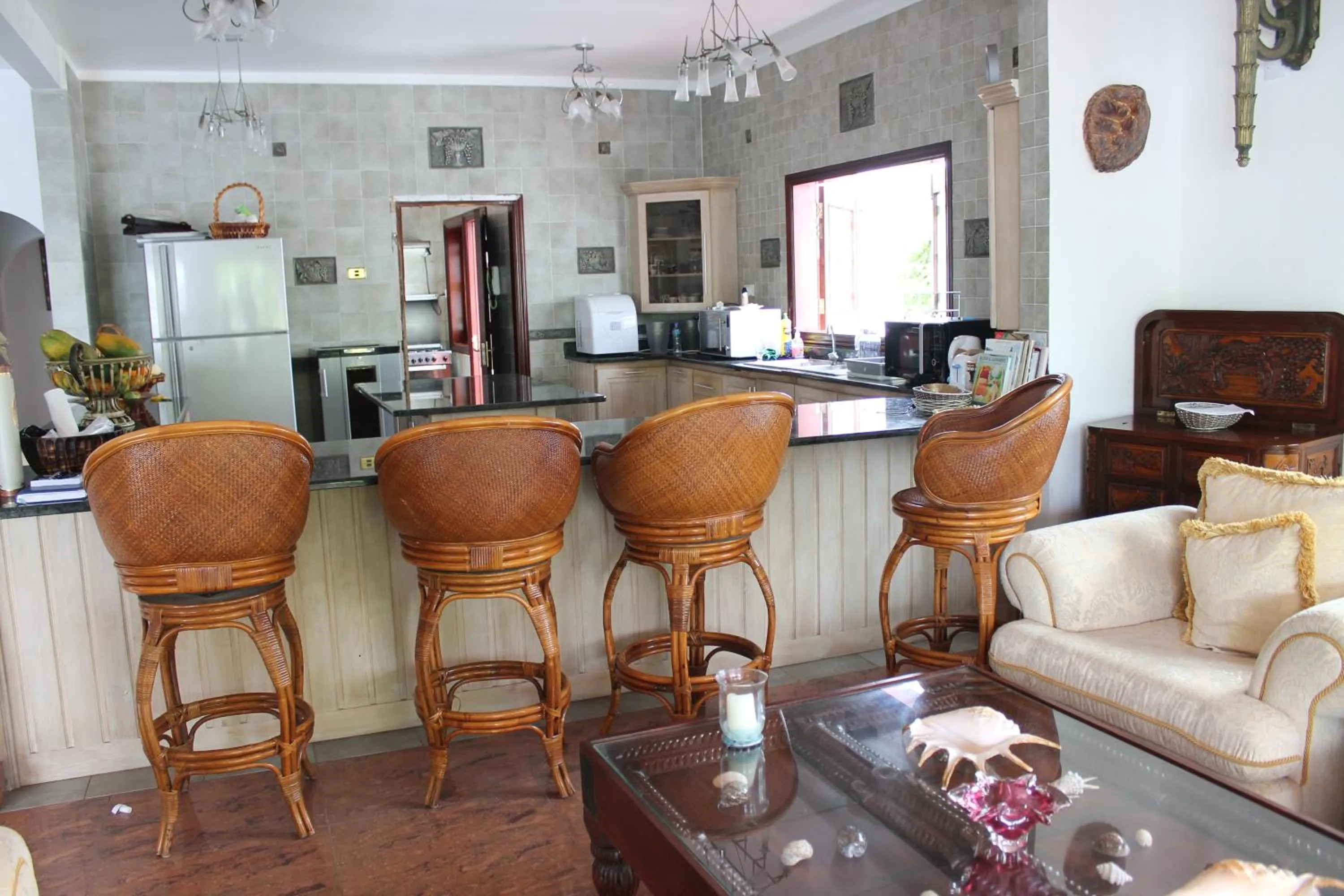 Communal lounge/ TV room in Le Bonheur Villa