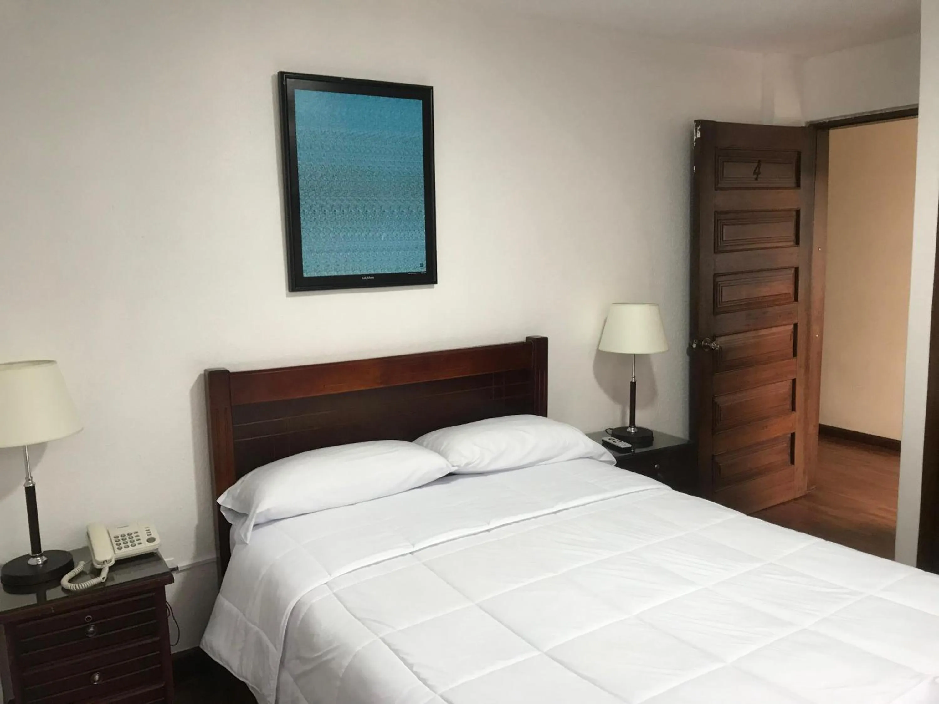 Bed in Altura Rooms & Suites