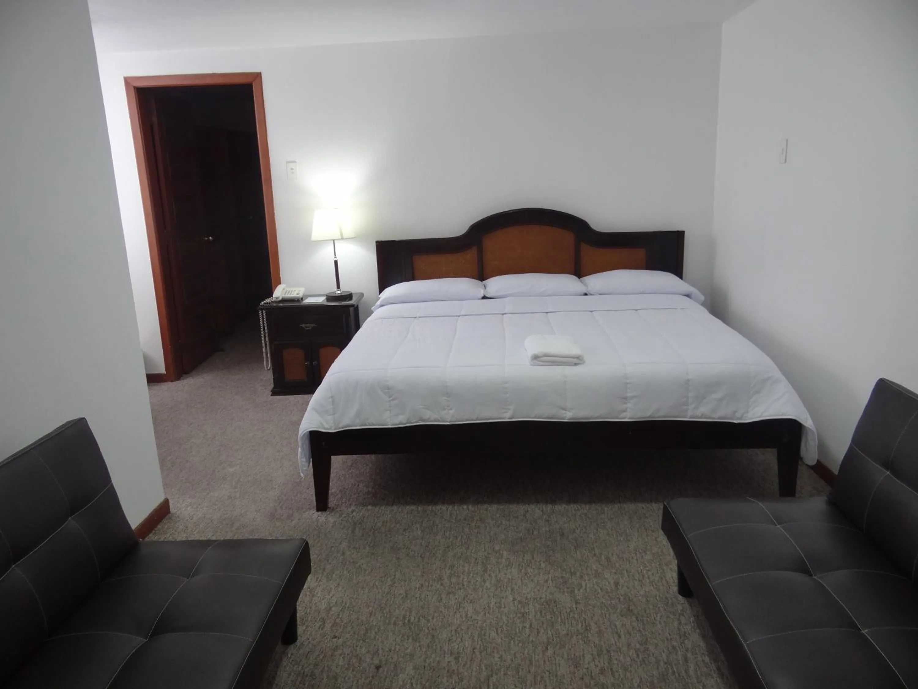 Bed in Altura Rooms & Suites