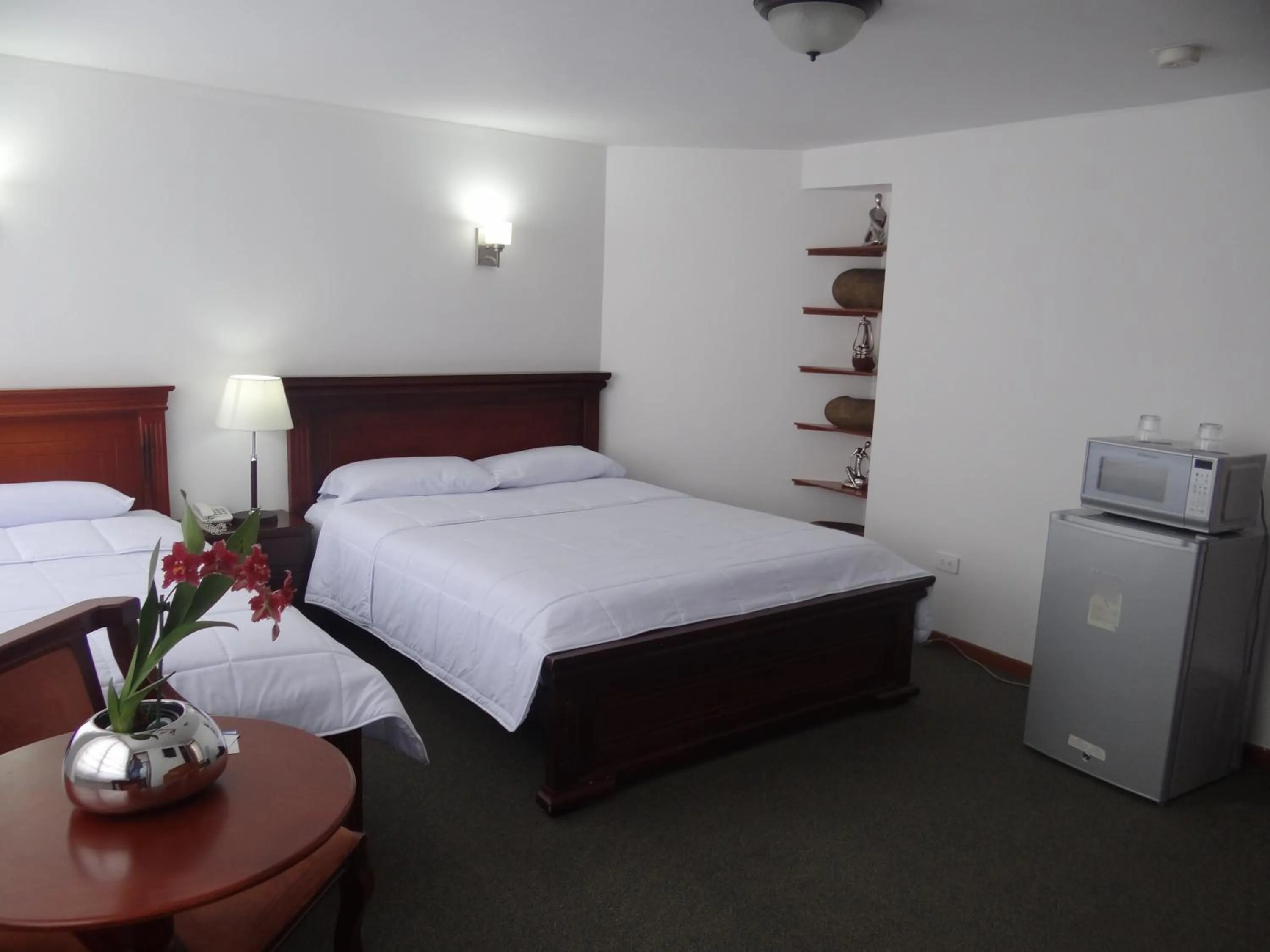 Bed in Altura Rooms & Suites