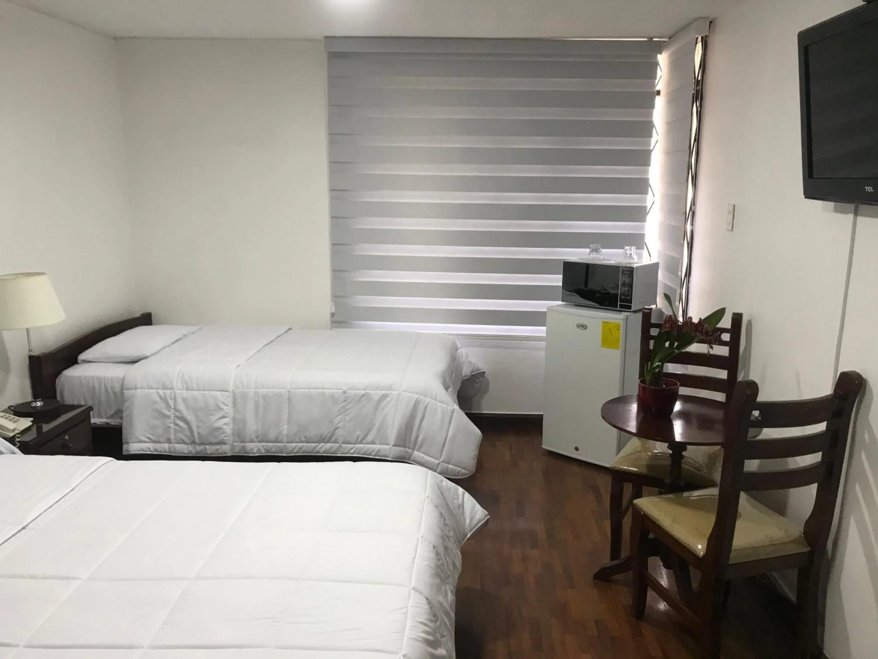 Bed in Altura Rooms & Suites