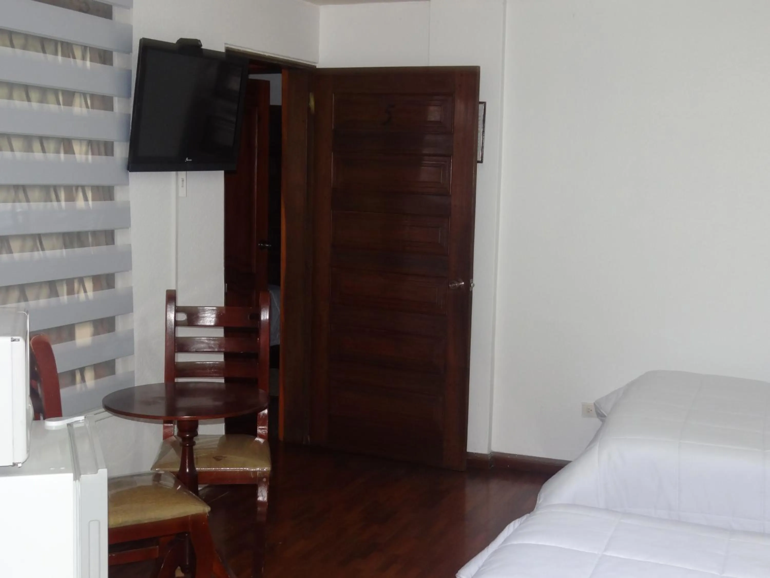 Bed in Altura Rooms & Suites