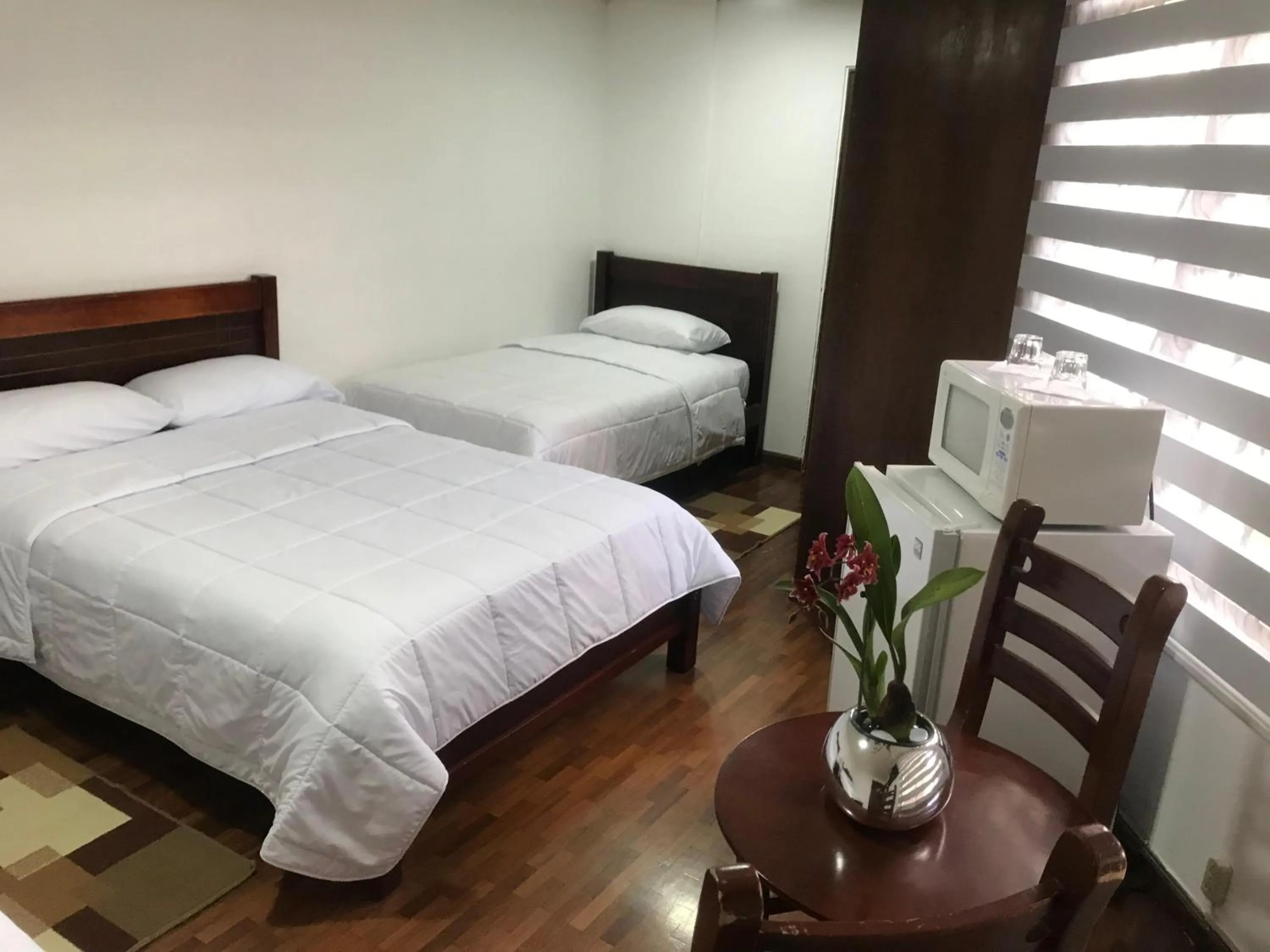 Bed in Altura Rooms & Suites