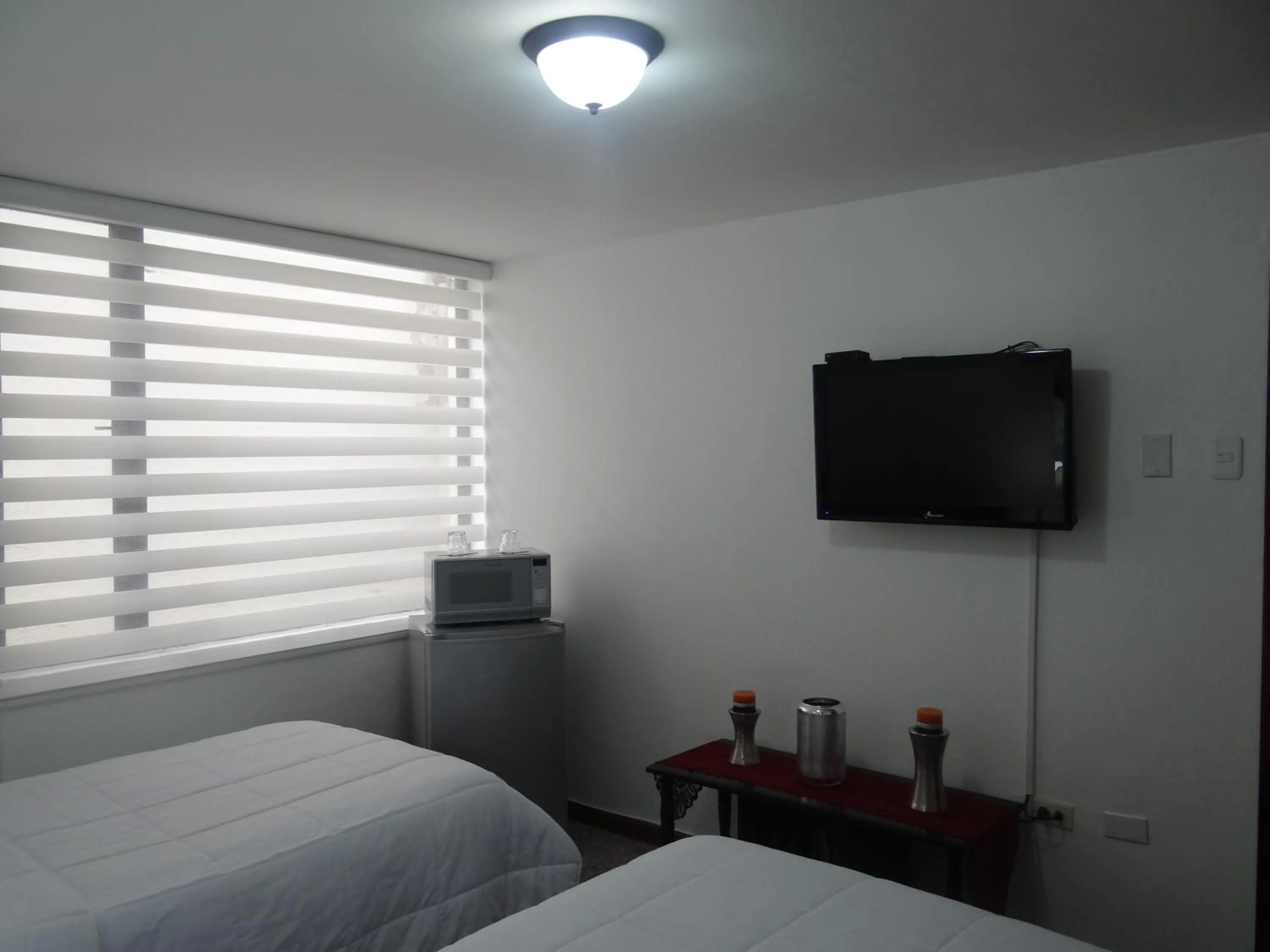Bed in Altura Rooms & Suites