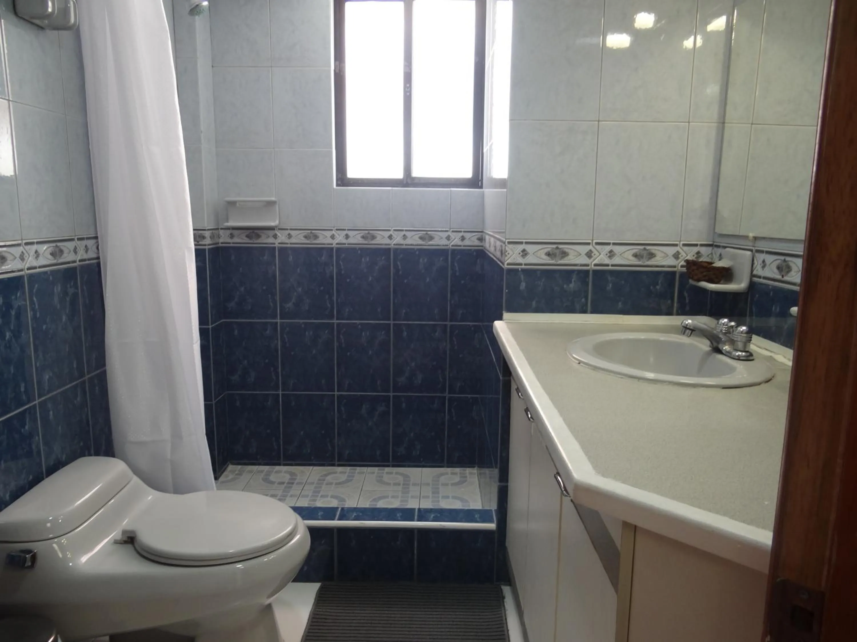 Bathroom in Altura Rooms & Suites