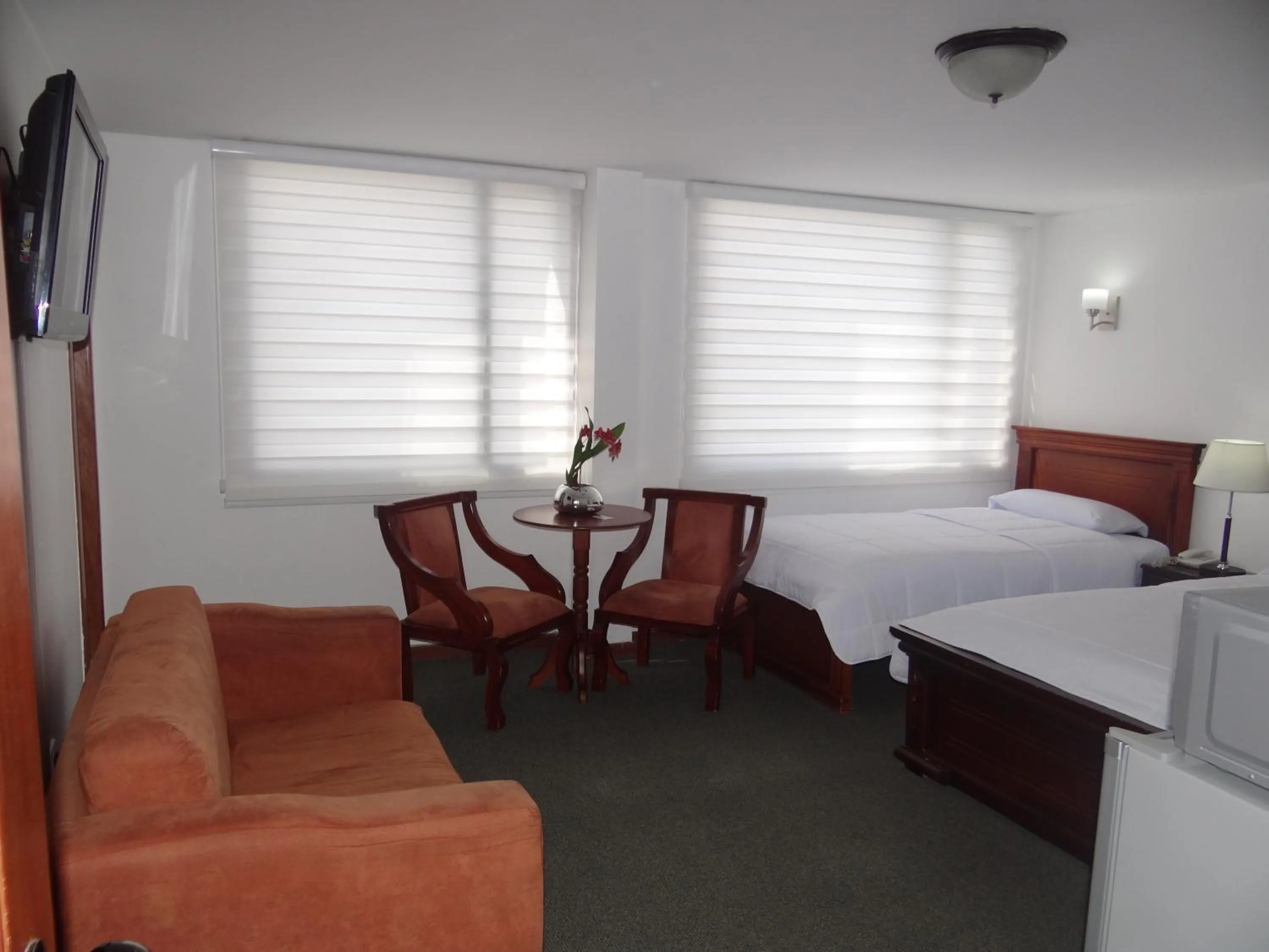 Bed in Altura Rooms & Suites