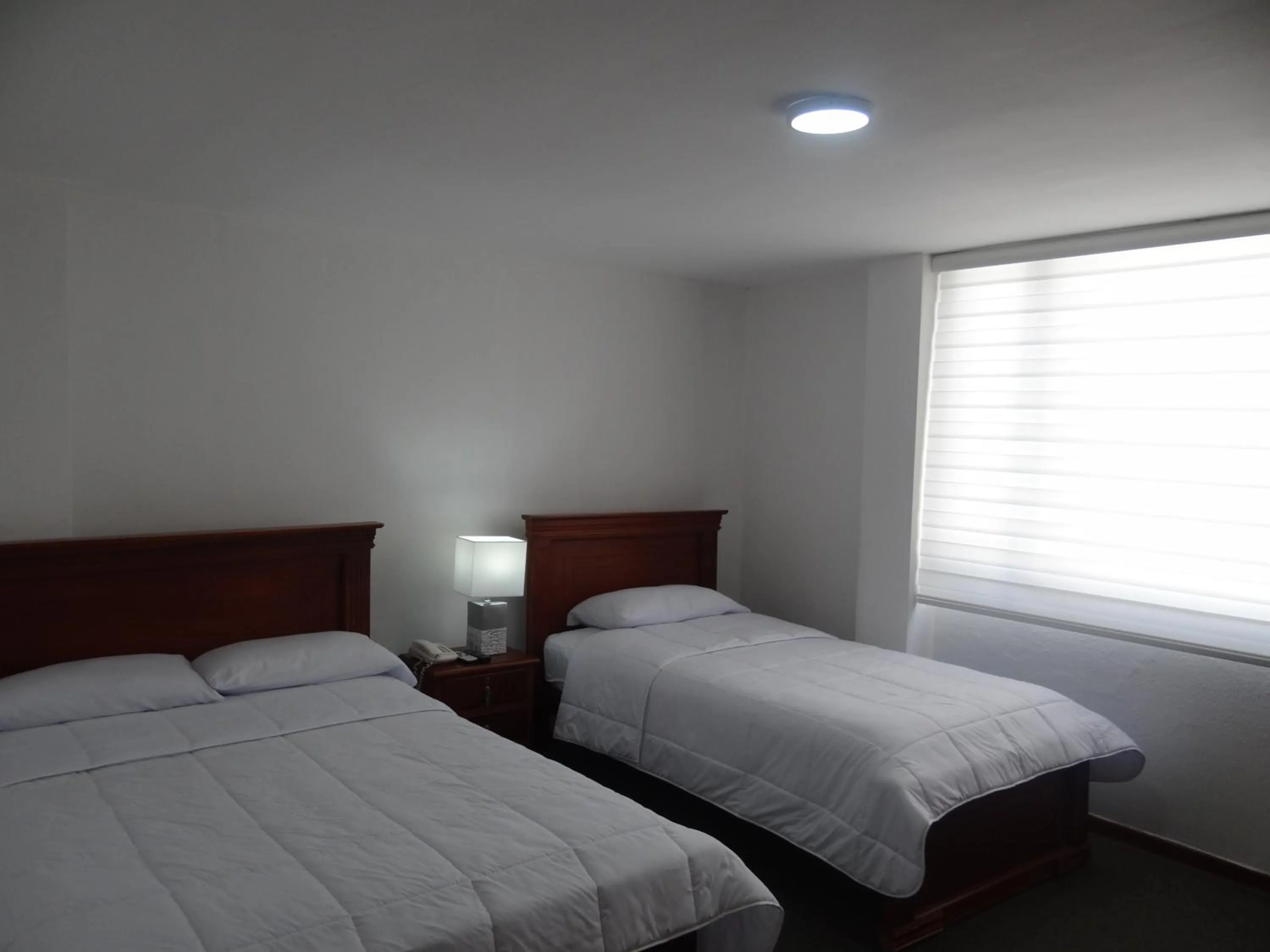 Bed in Altura Rooms & Suites