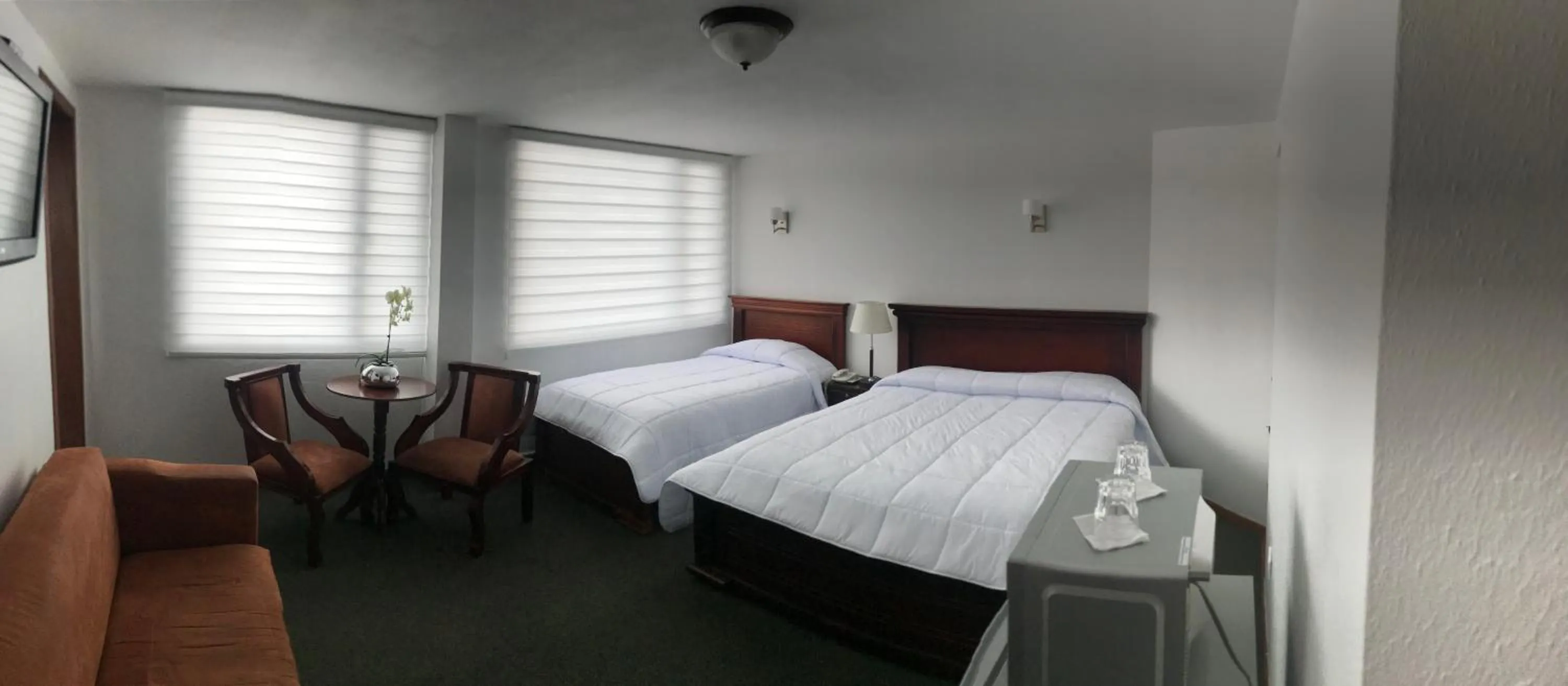 Bed in Altura Rooms & Suites