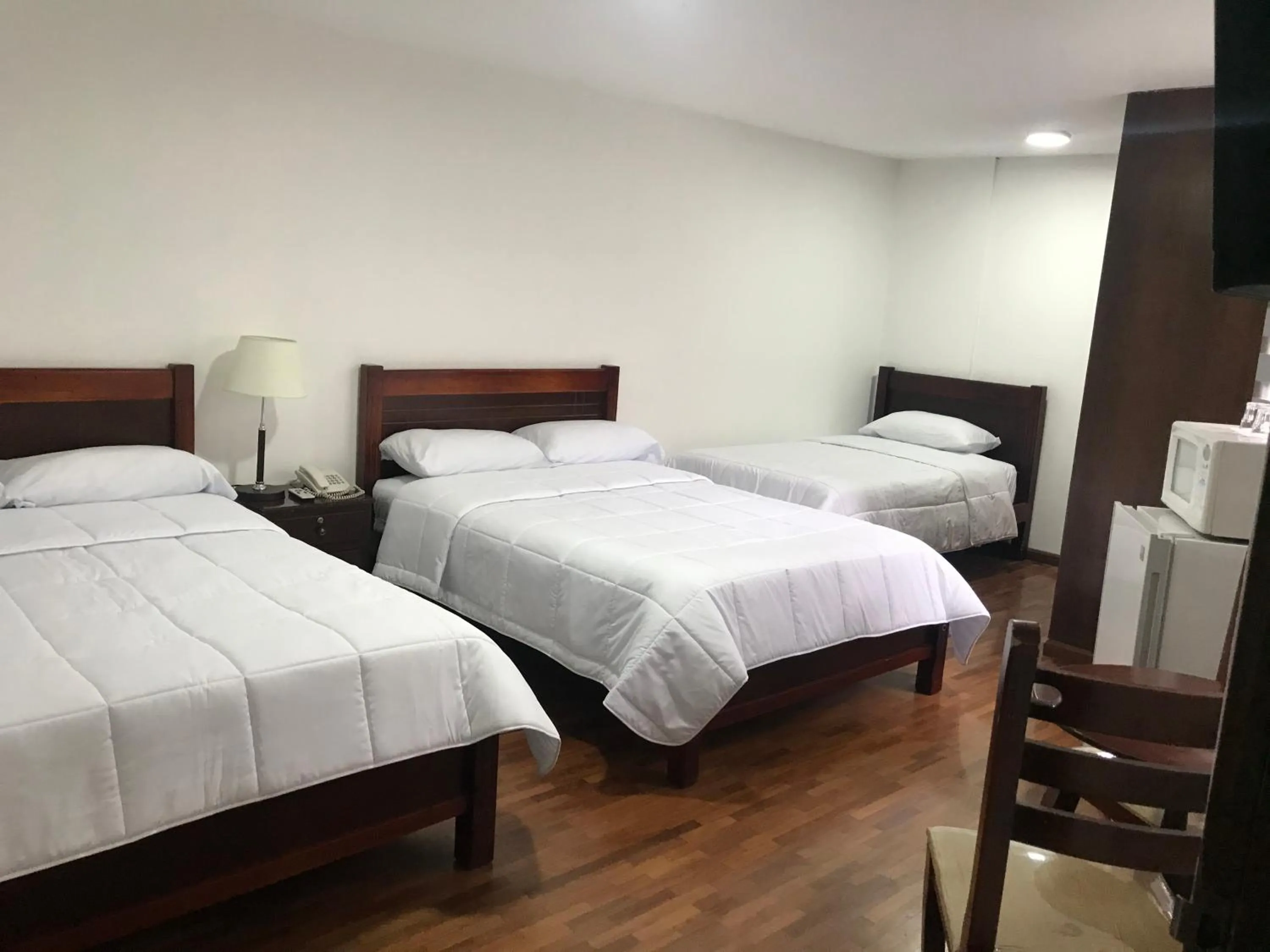 Bed in Altura Rooms & Suites