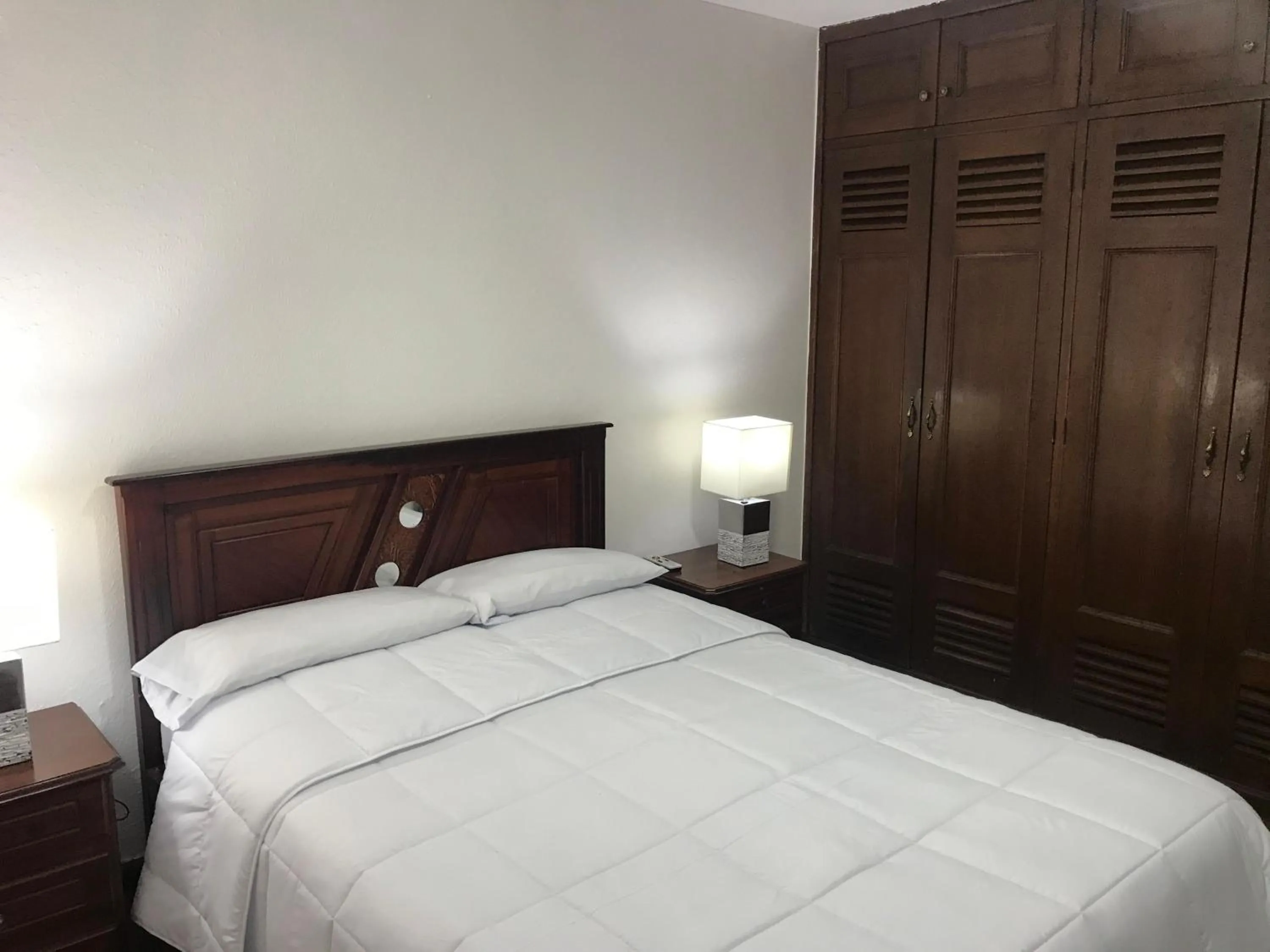 Bed in Altura Rooms & Suites