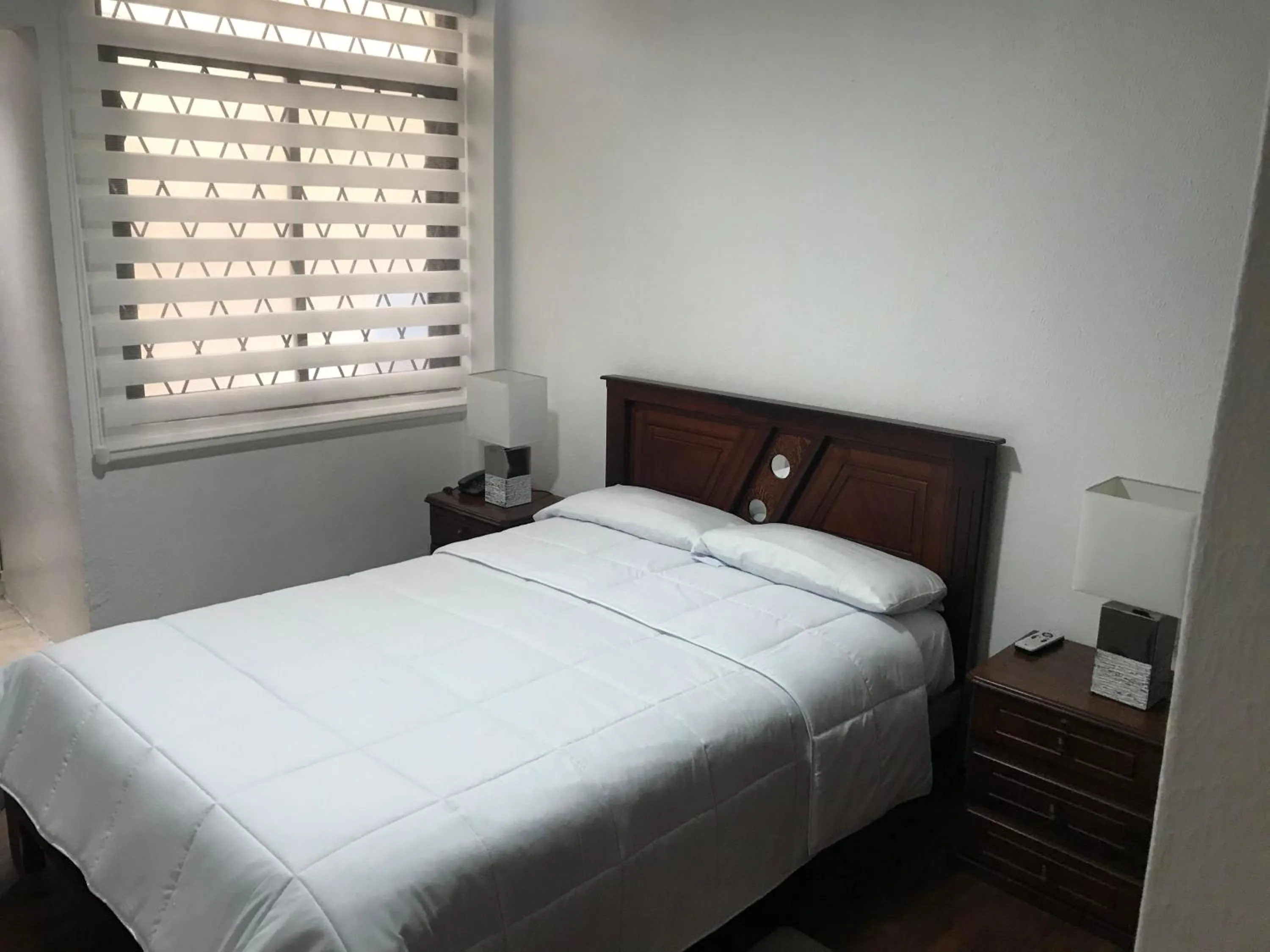 Bed in Altura Rooms & Suites