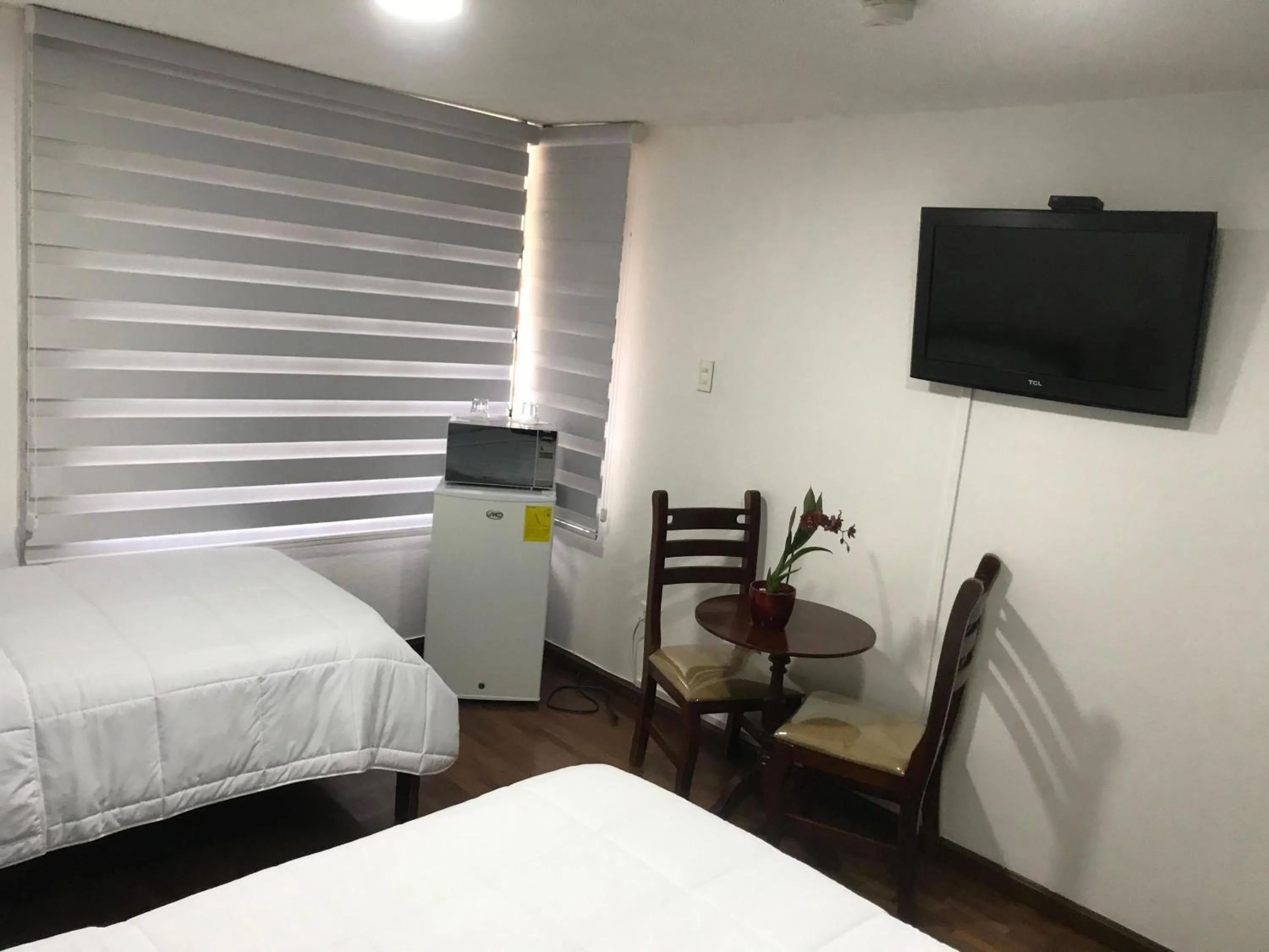 Bed in Altura Rooms & Suites