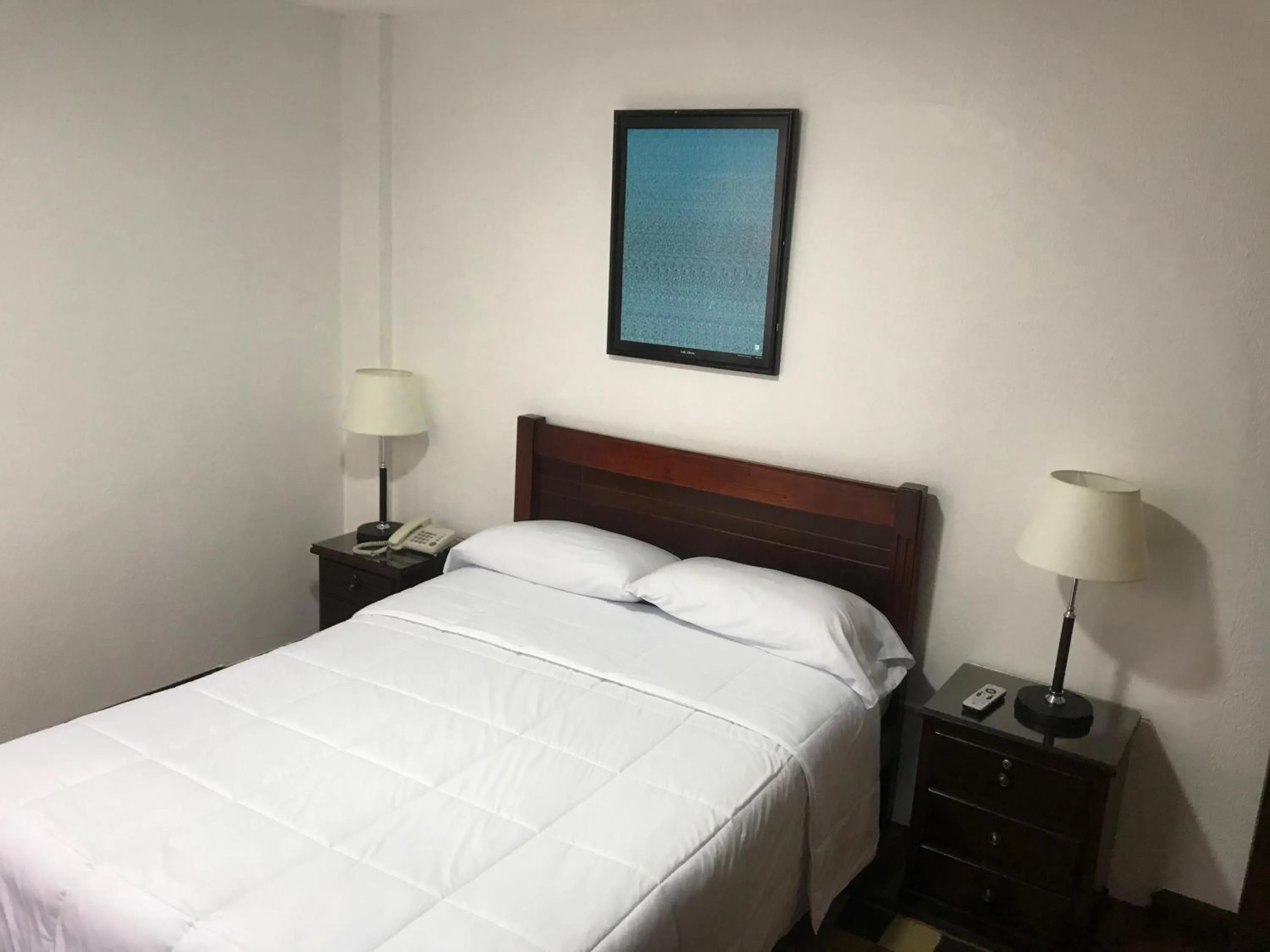 Bed in Altura Rooms & Suites