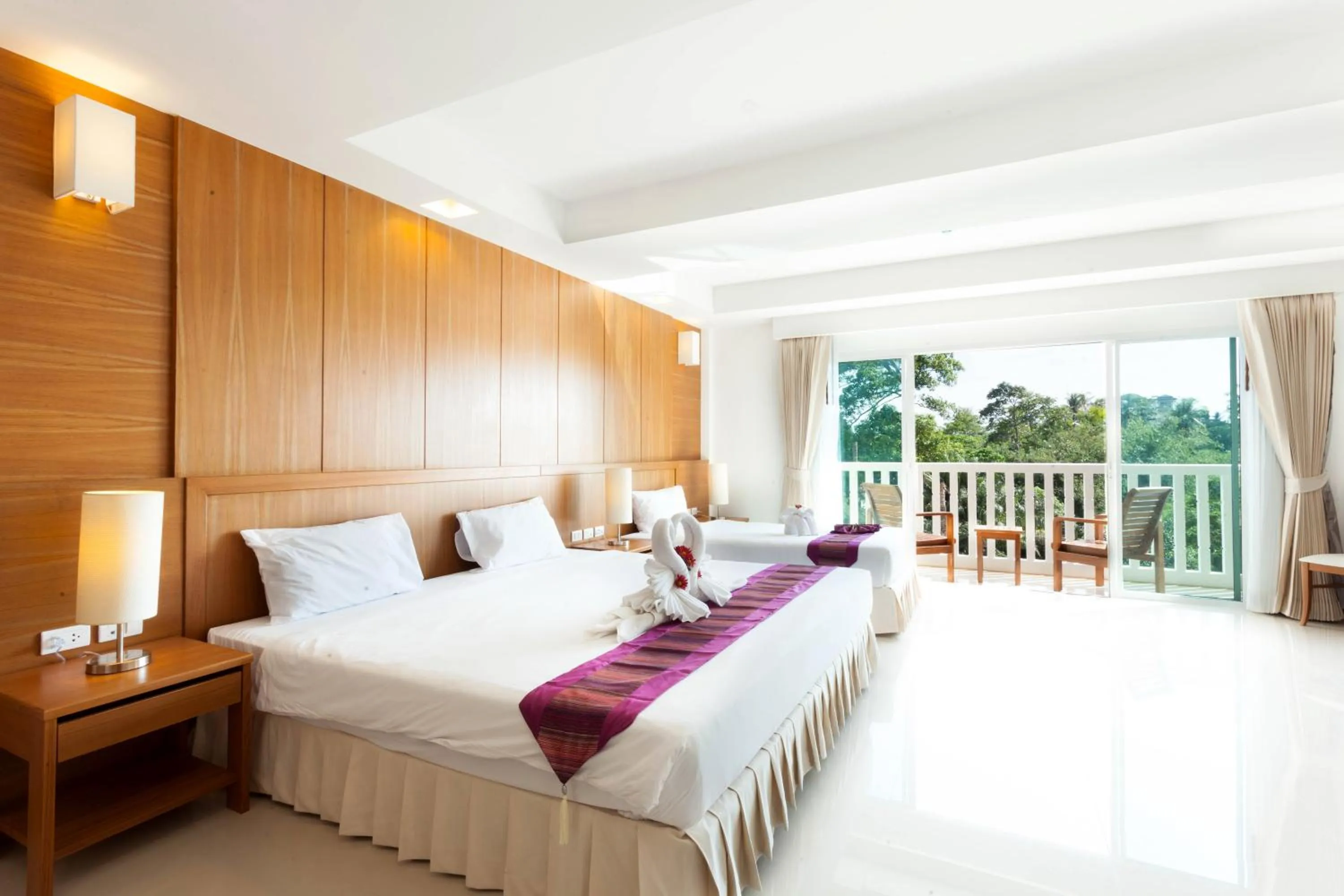 Bed in Rawai Princess Hotel