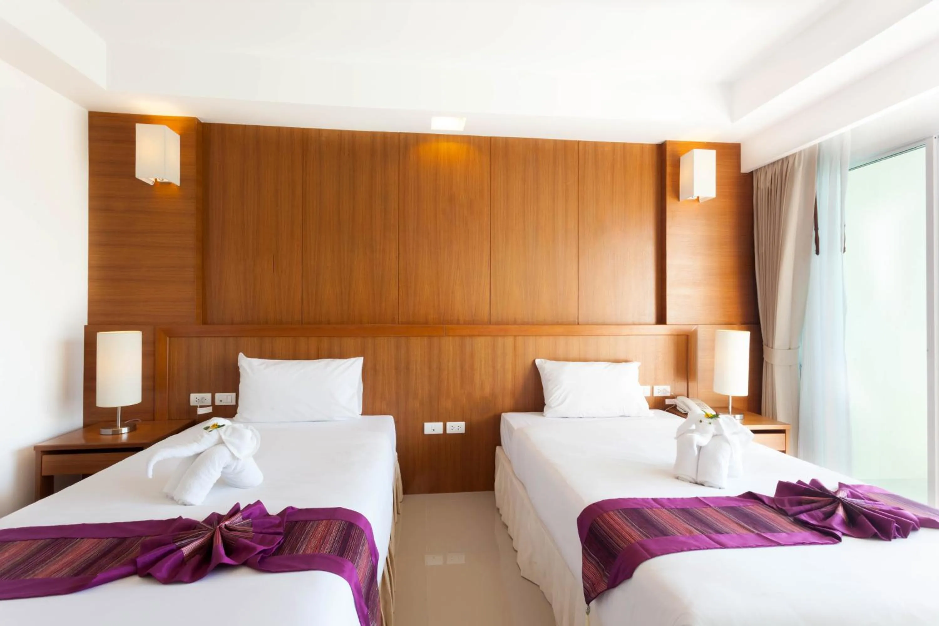 Bed in Rawai Princess Hotel