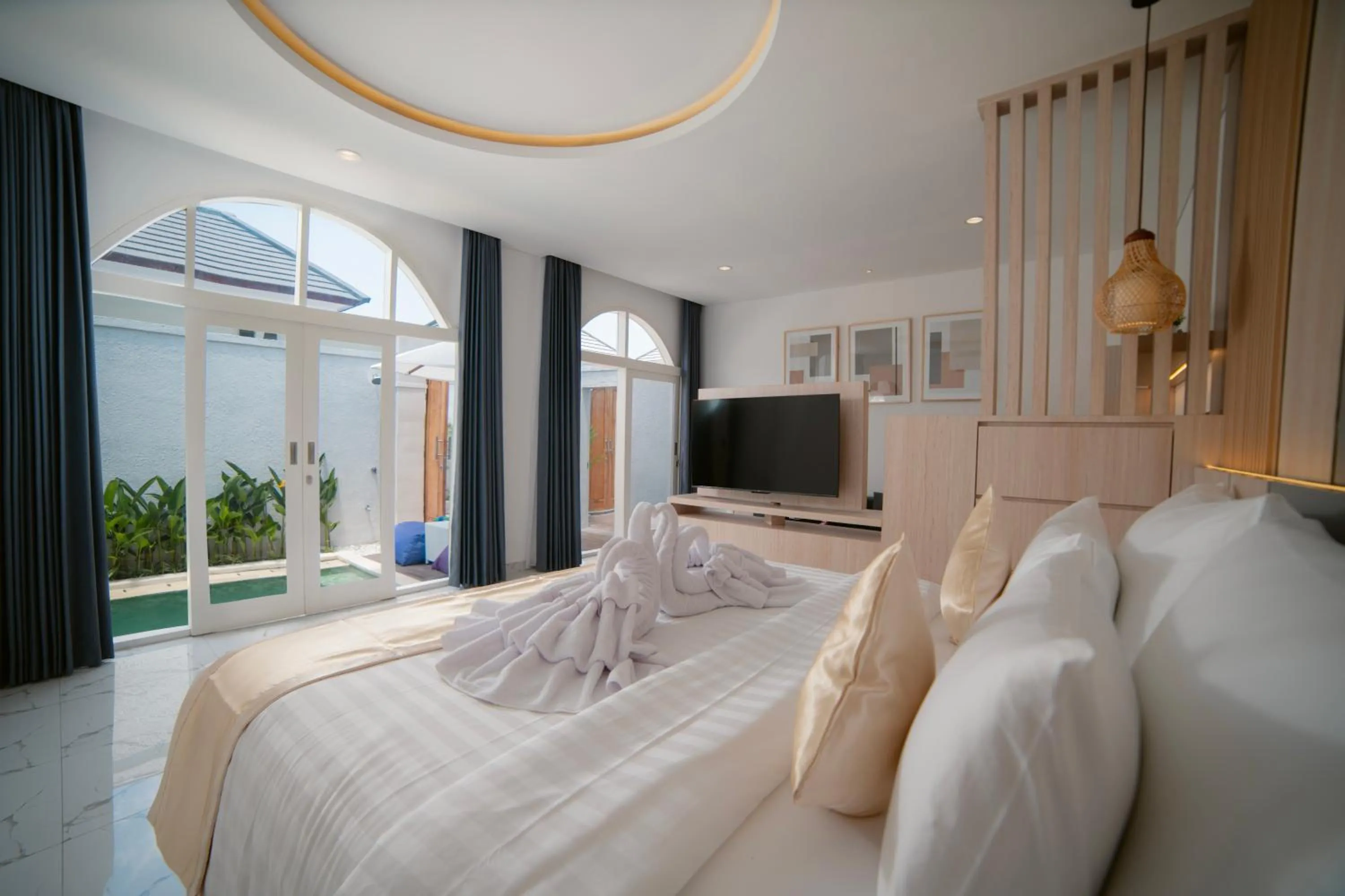 Bed in Dikubu Bali Villa and Suites