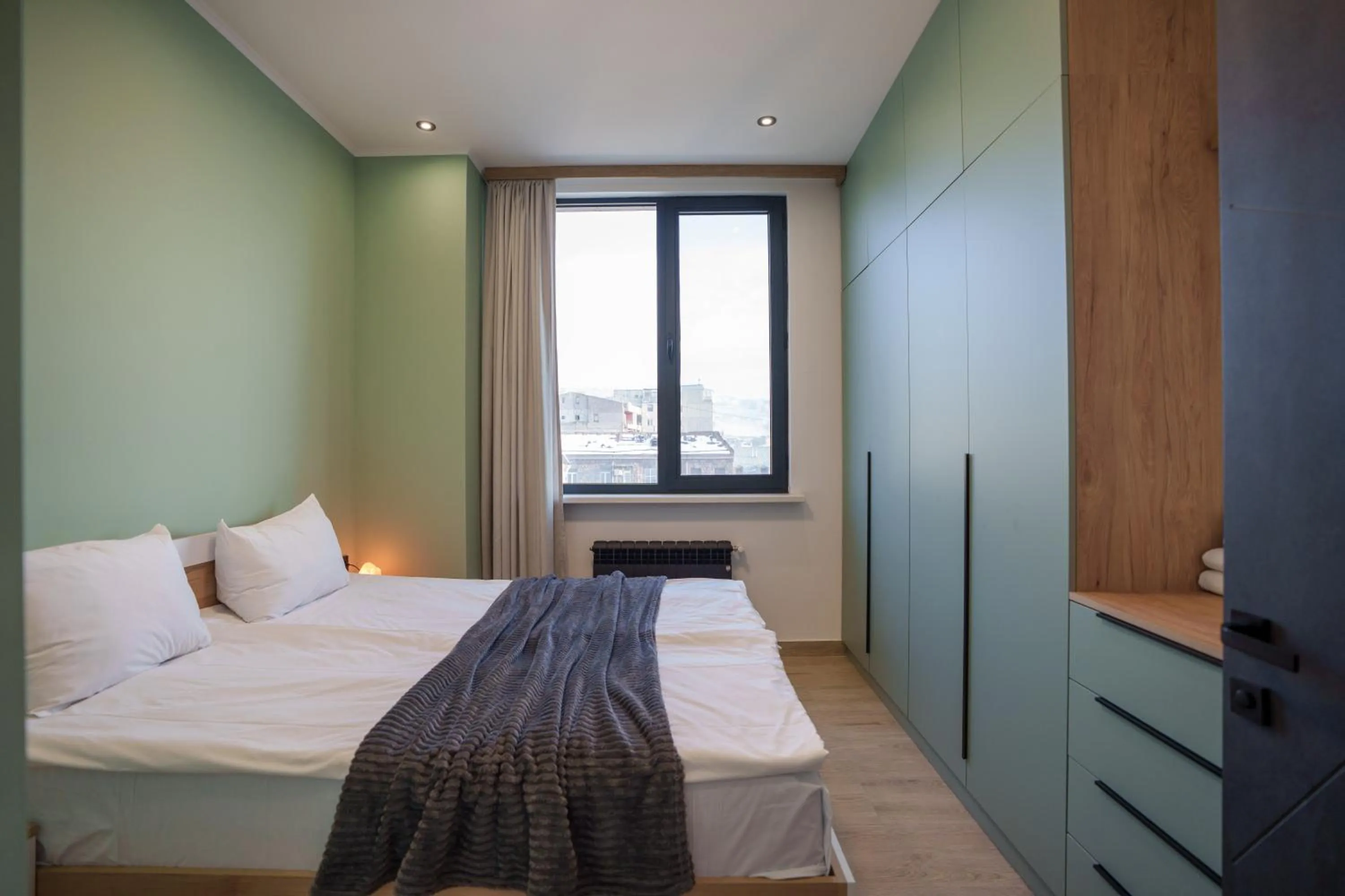 Bed in RIS Central Apartments Yerevan