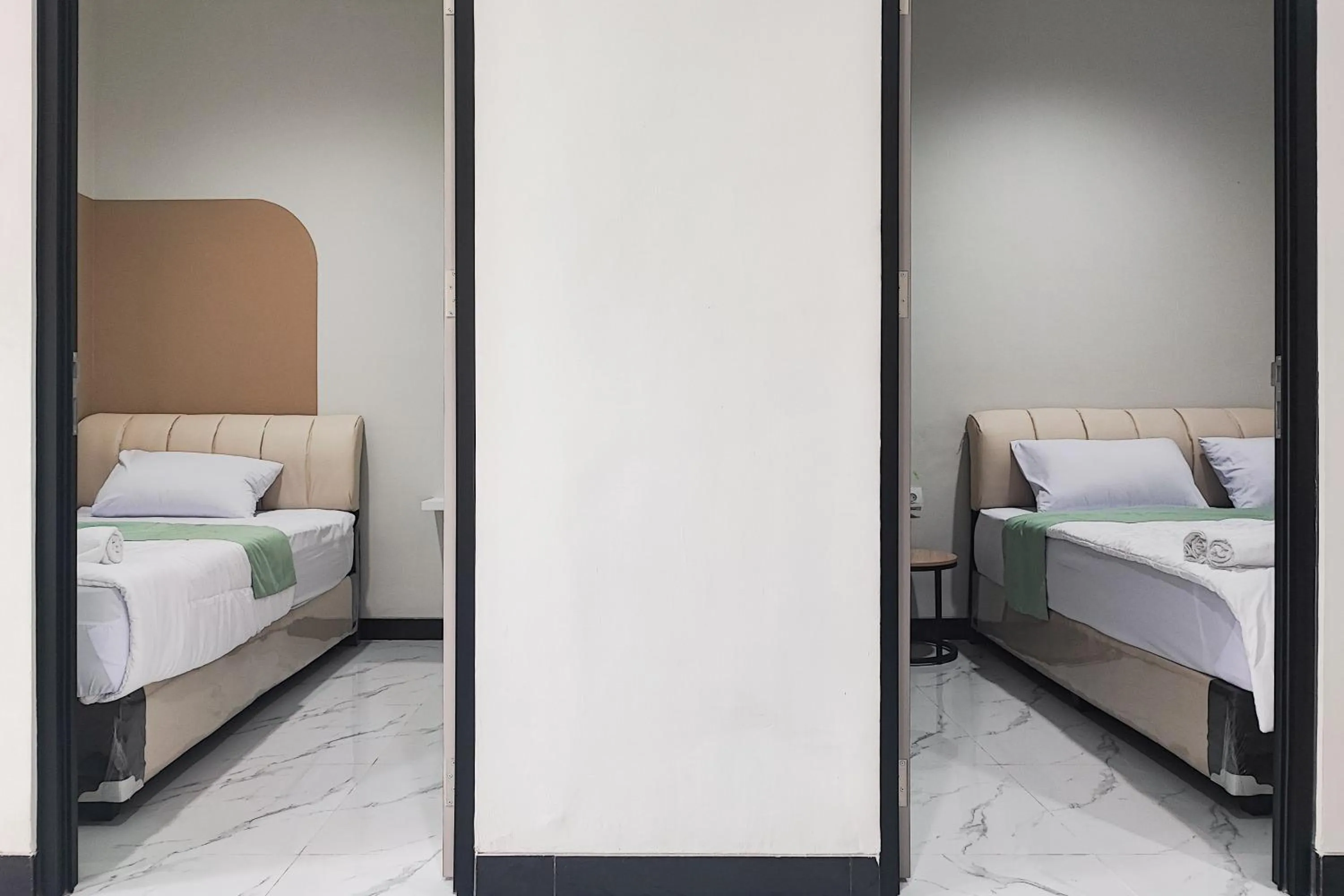 Bedroom in Urbanview Hotel at Pesona Guest House Jambi