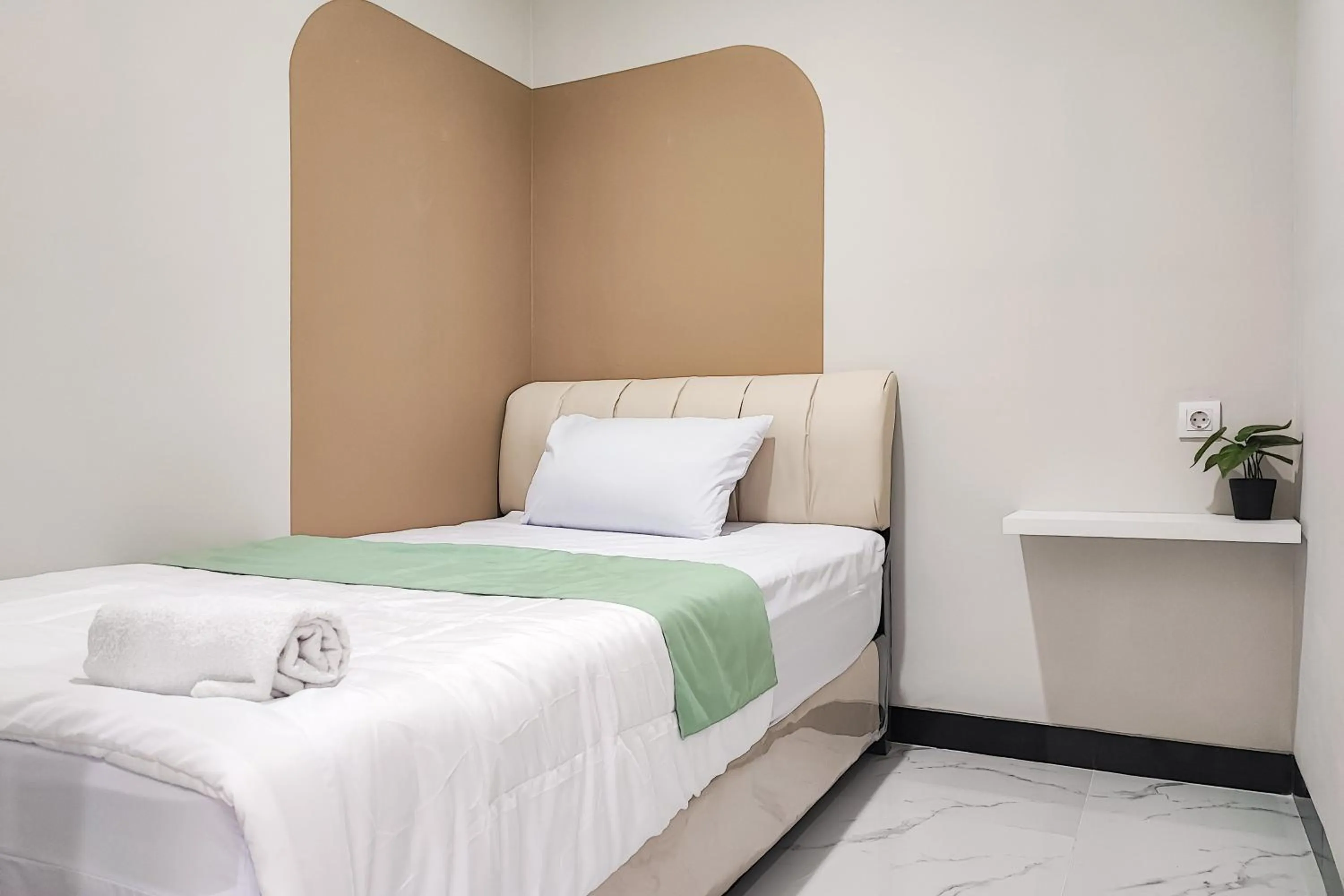 Bedroom in Urbanview Hotel at Pesona Guest House Jambi