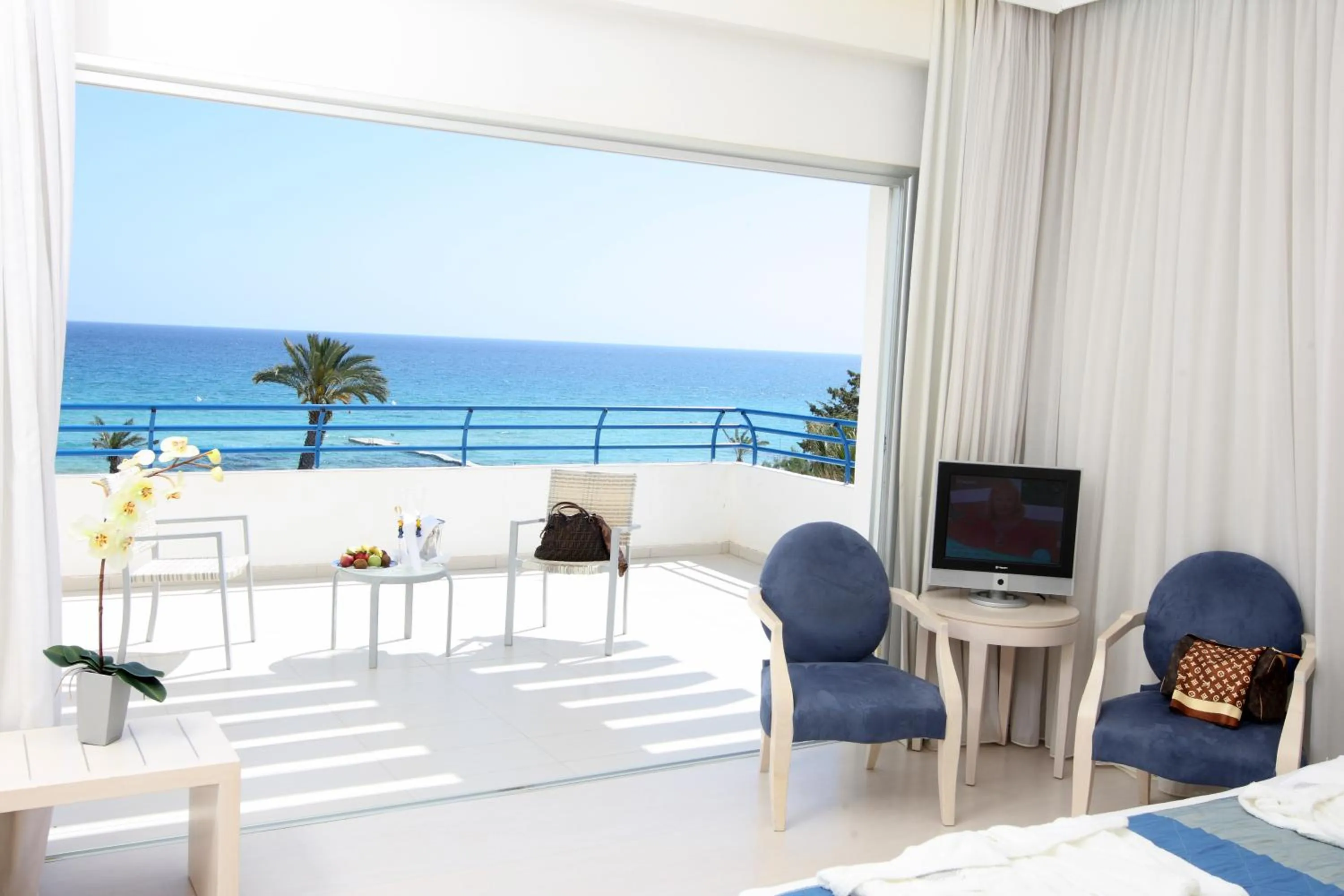 Communal lounge/ TV room in Vrissiana Boutique Beach Hotel