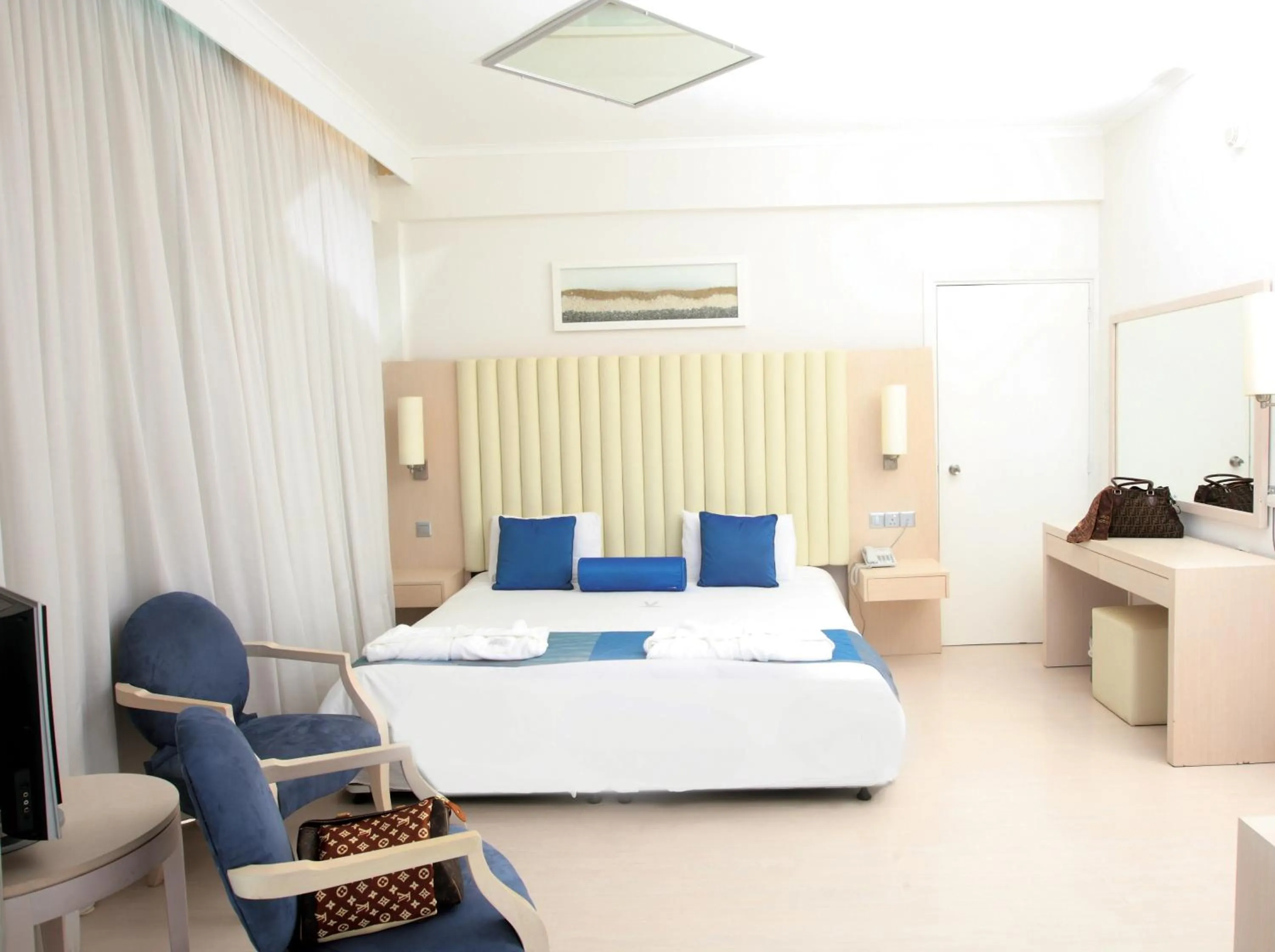 Bed in Vrissiana Boutique Beach Hotel