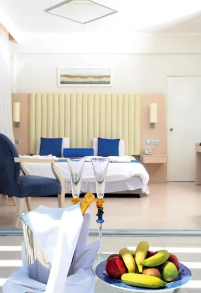 Bed in Vrissiana Boutique Beach Hotel