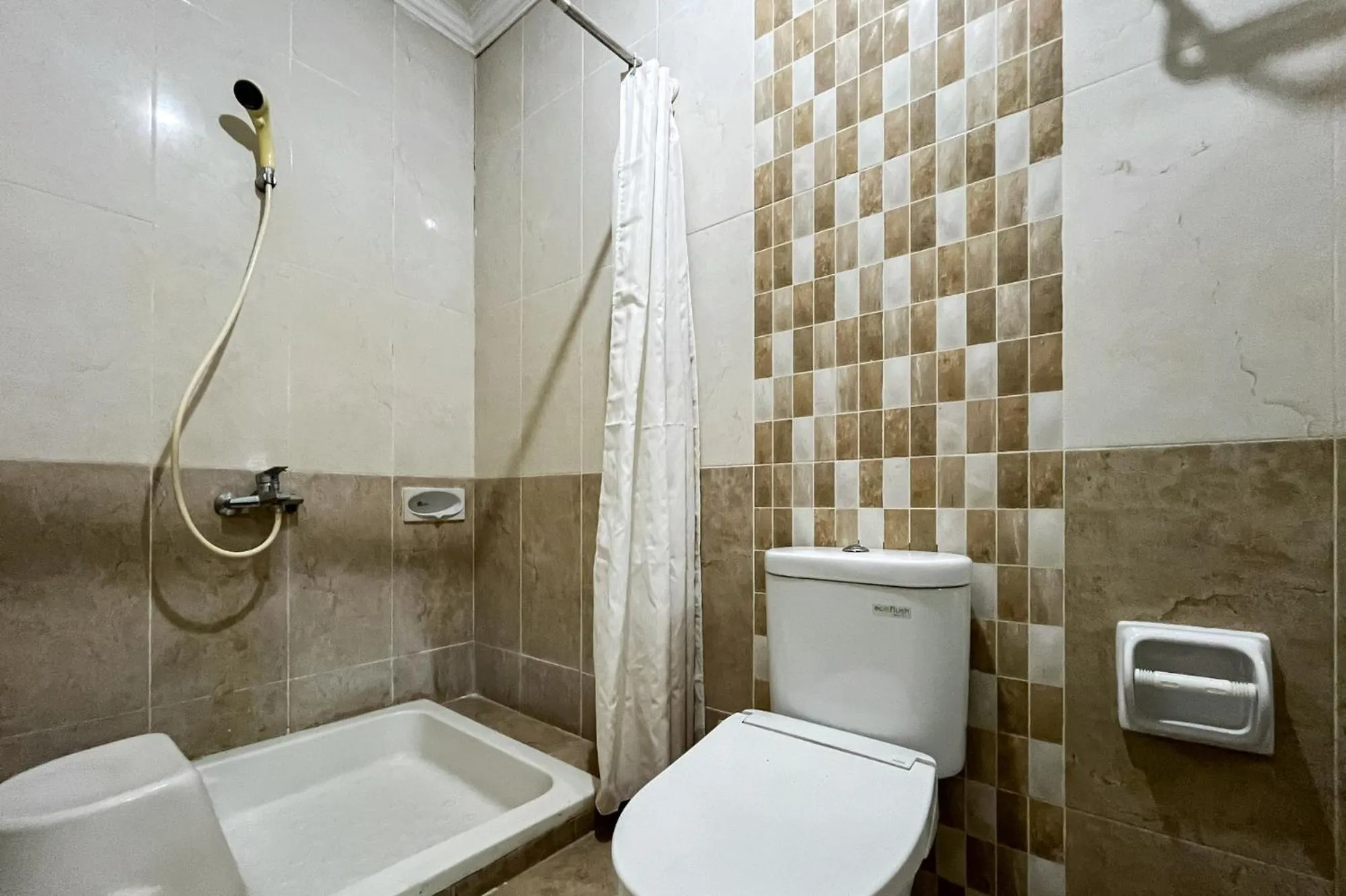 Bathroom in Urbanview de Dharmawangsa Suite Hotel
