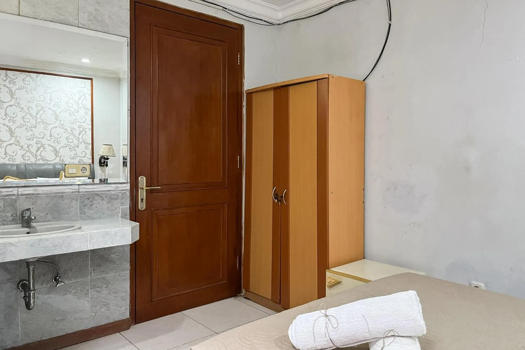 Bedroom in Urbanview de Dharmawangsa Suite Hotel