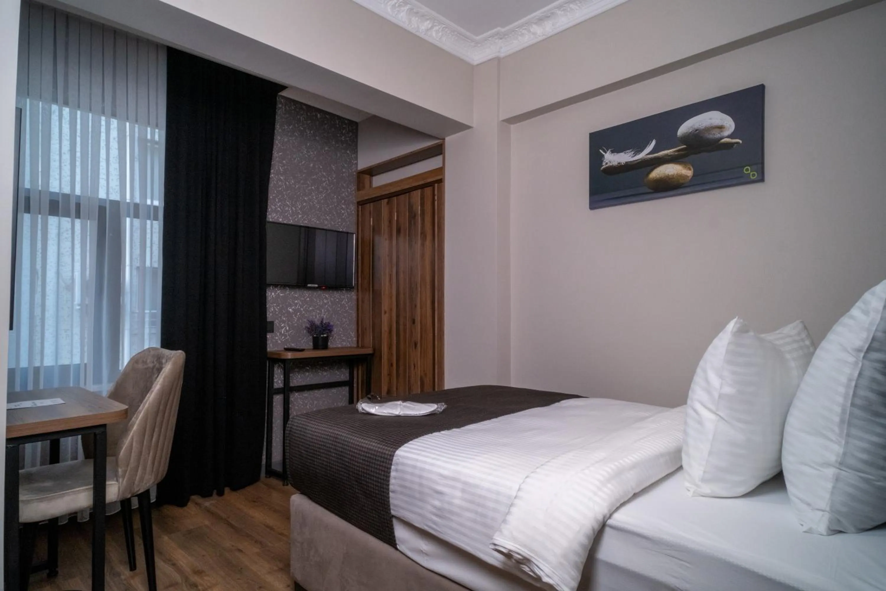 Bed in Grand CLOVER Hotel