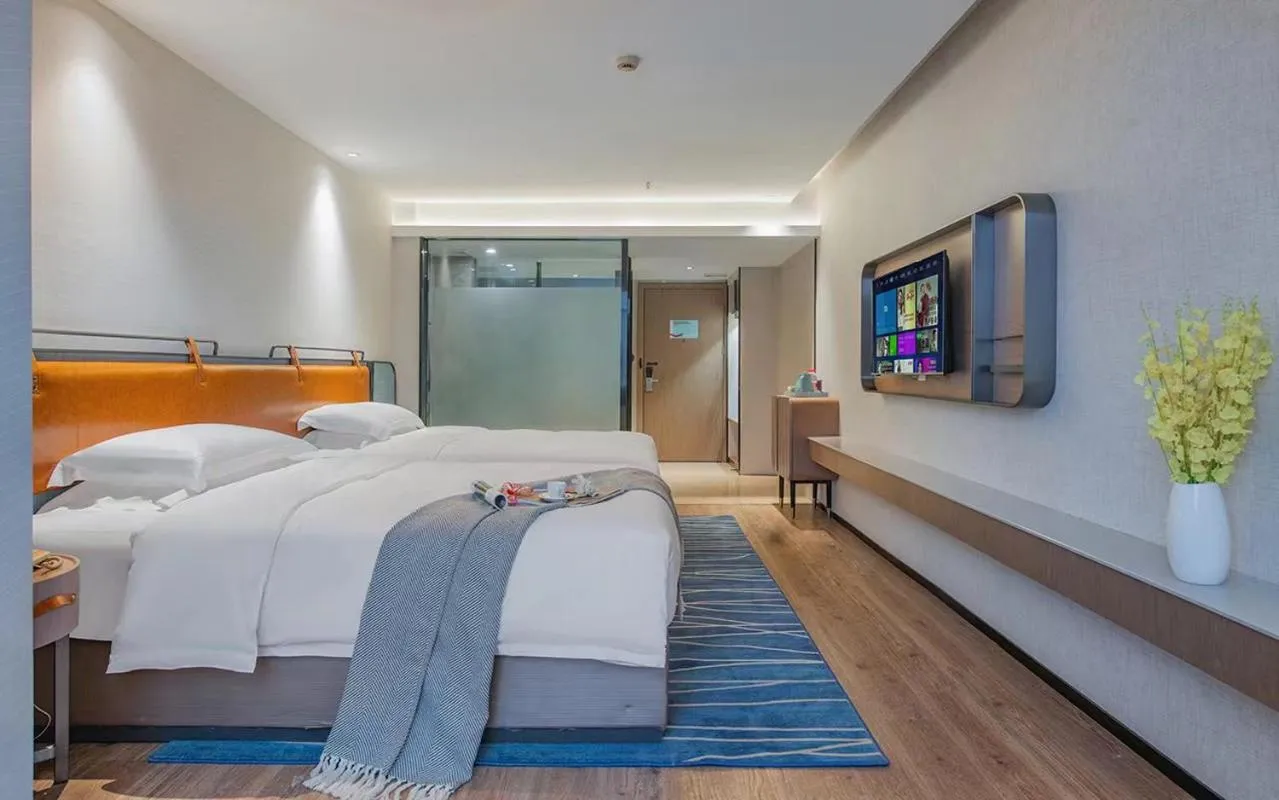 Bed in Echarm Hotel Guangzhou Jiahe Helong Branch