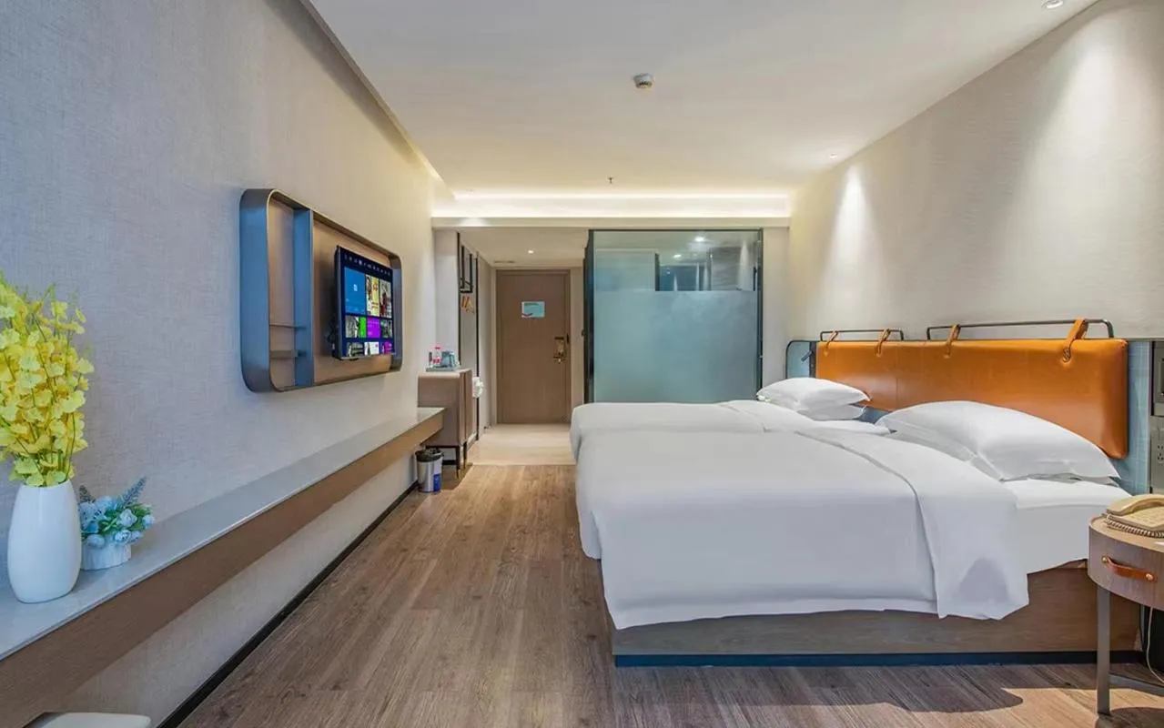 Bed in Echarm Hotel Guangzhou Jiahe Helong Branch