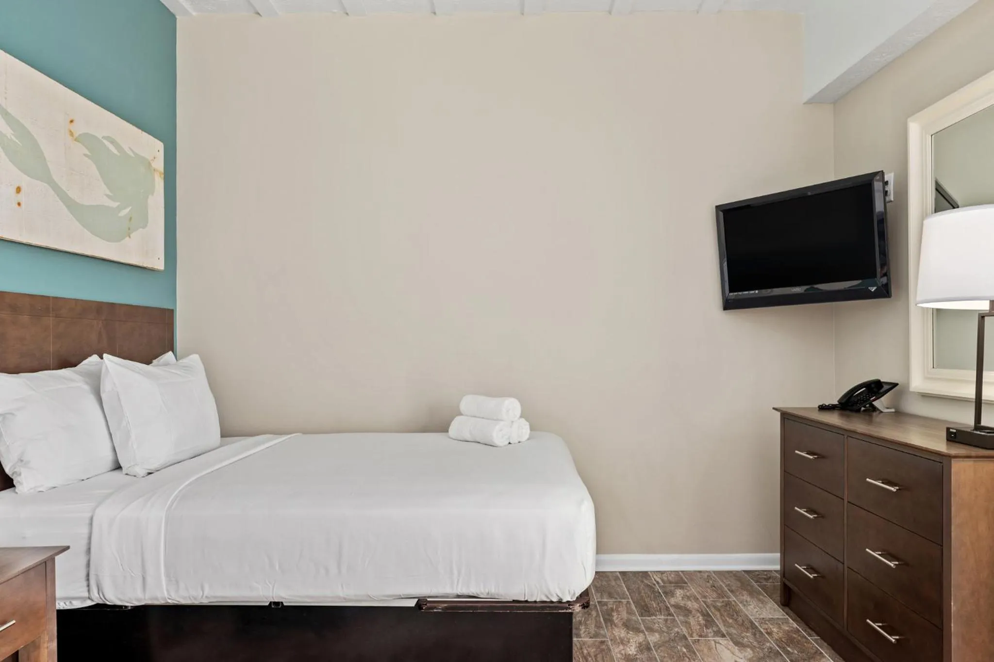 Bed in Sandpiper Beacon Beach Resort